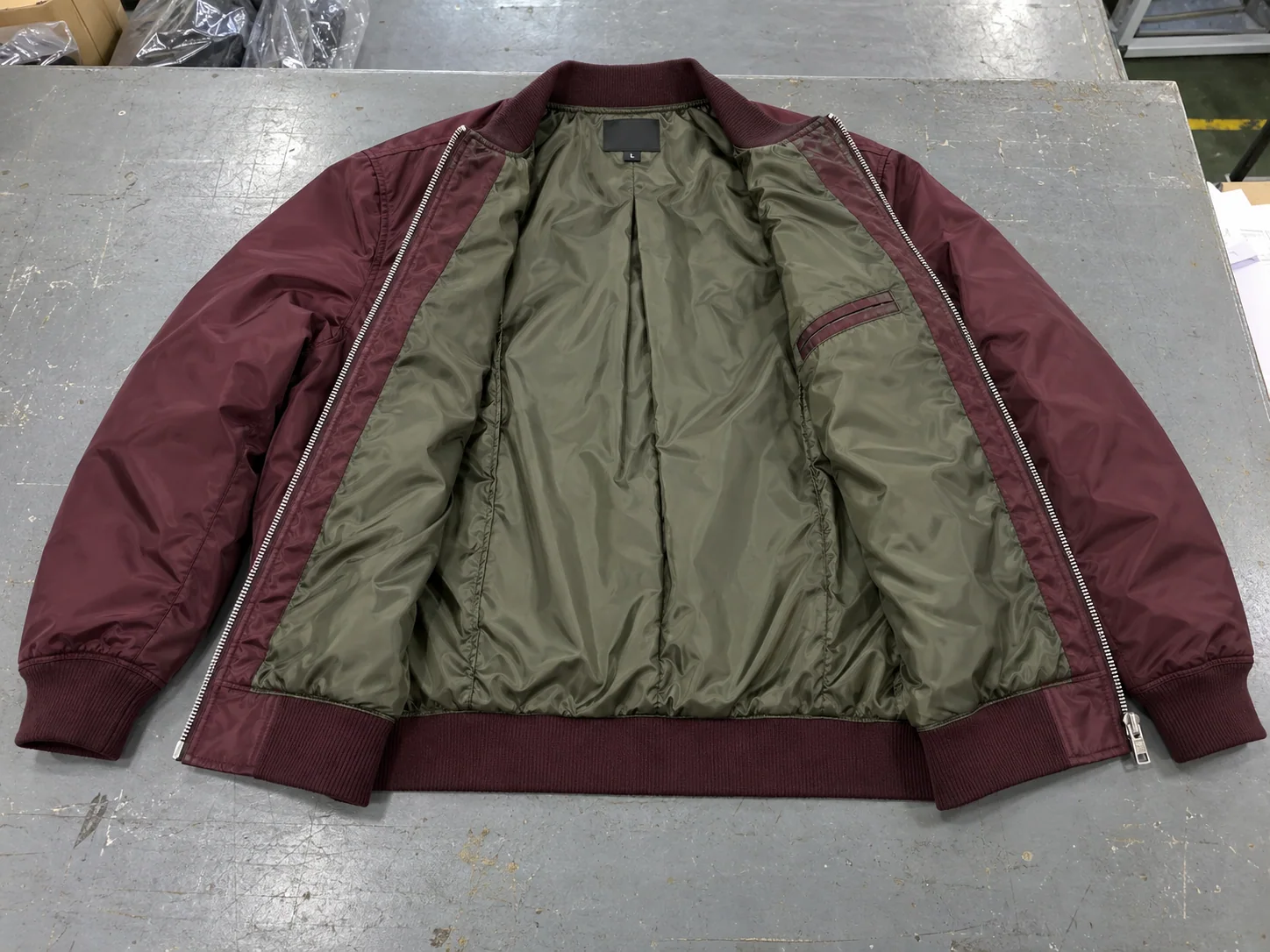 Open burgundy bomber jacket with olive polyester taffeta lining
