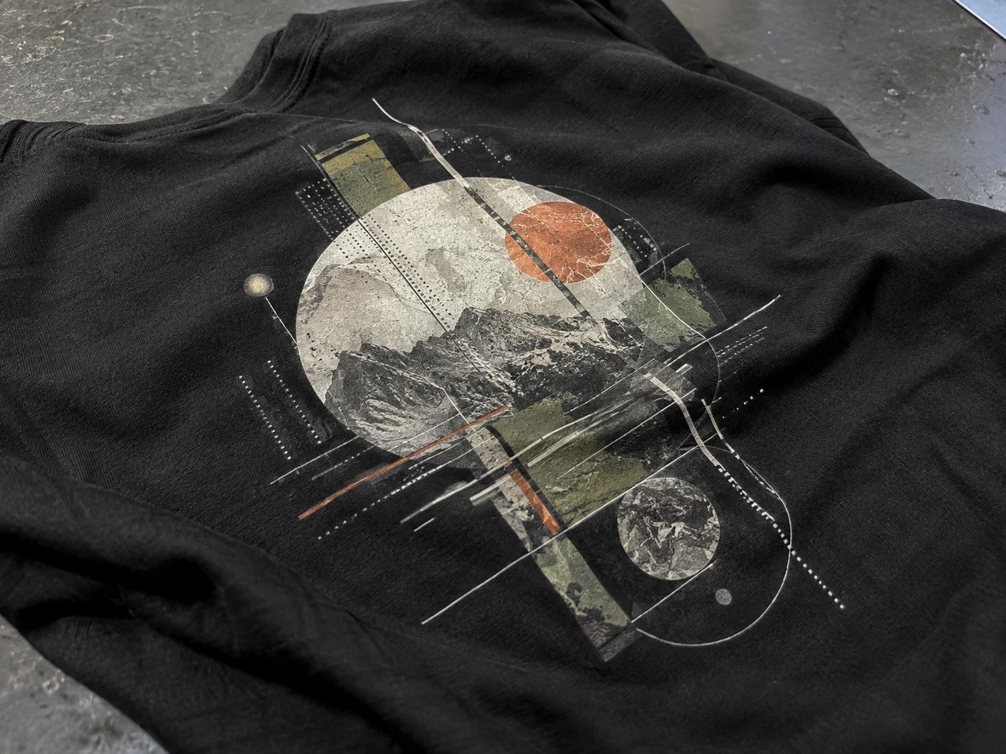 Close view of a detailed multicolor DTF graphic on a black garment