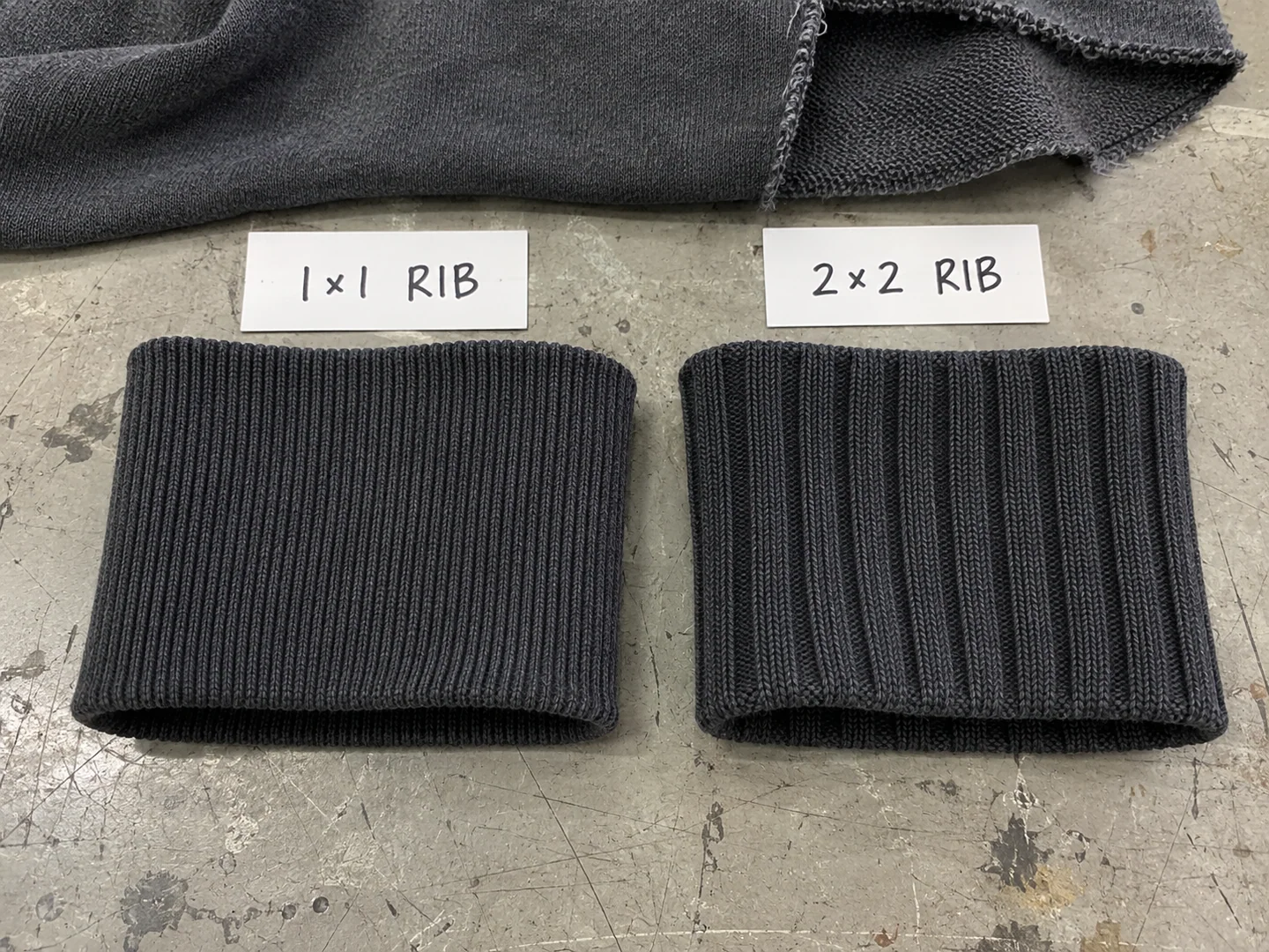 Black 1 by 1 and 2 by 2 rib-knit cuff samples compared side by side