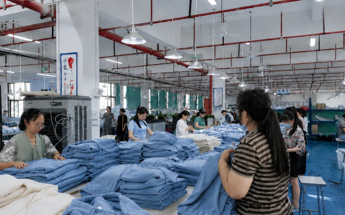 Garments being sorted and organized in the KAOUYOU finishing department