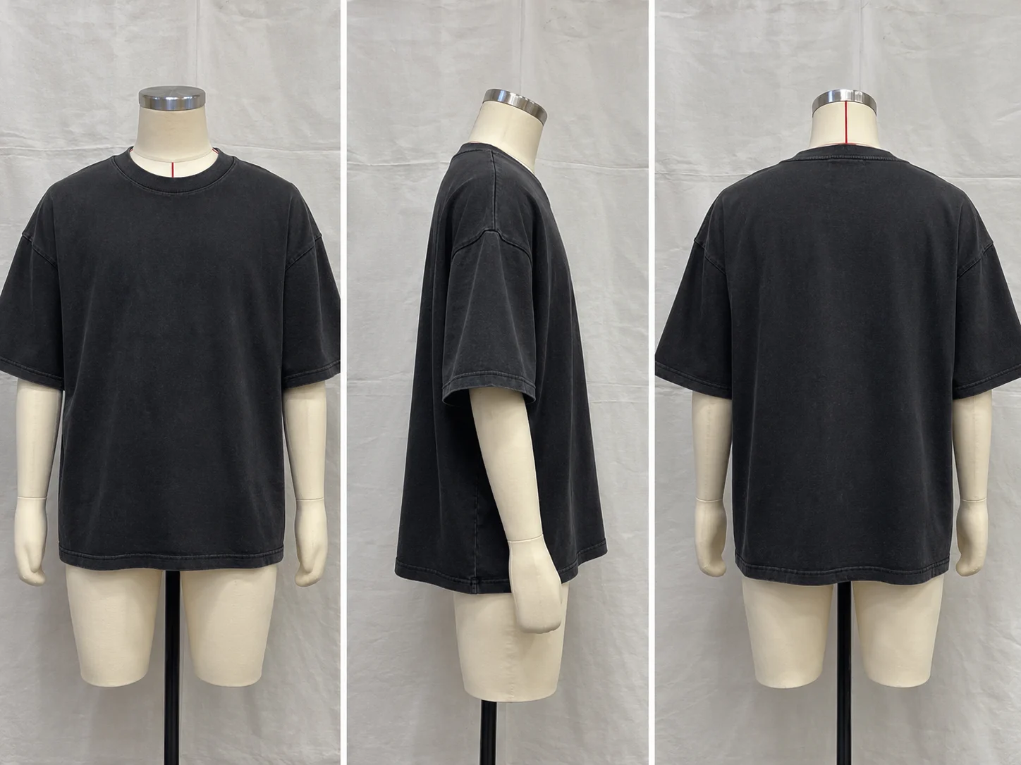 Washed black oversized T-shirt shown on a mannequin from the front, side and back