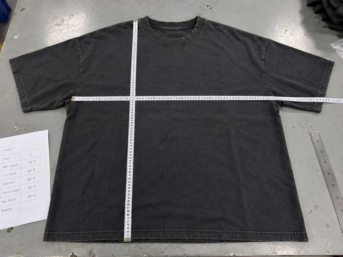 Washed oversized T-shirt laid flat for HPS length, chest and shoulder measurement checks