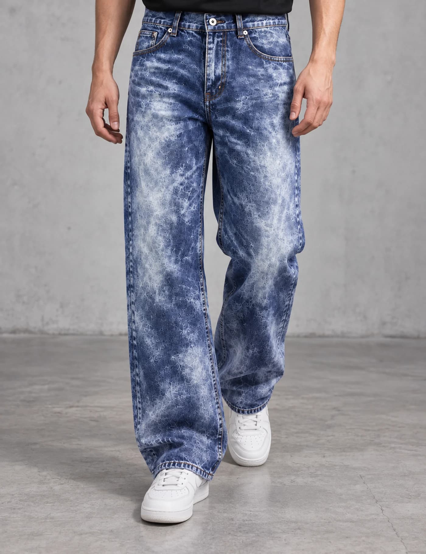 Lower-body view of a male model wearing blue acid-wash wide-leg jeans