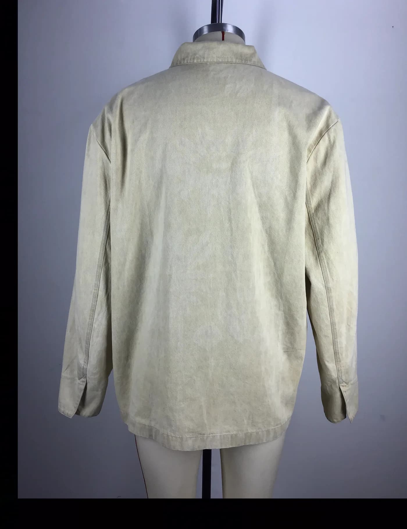 Actual beige washed zip coach jacket sample shown from the back on a mannequin