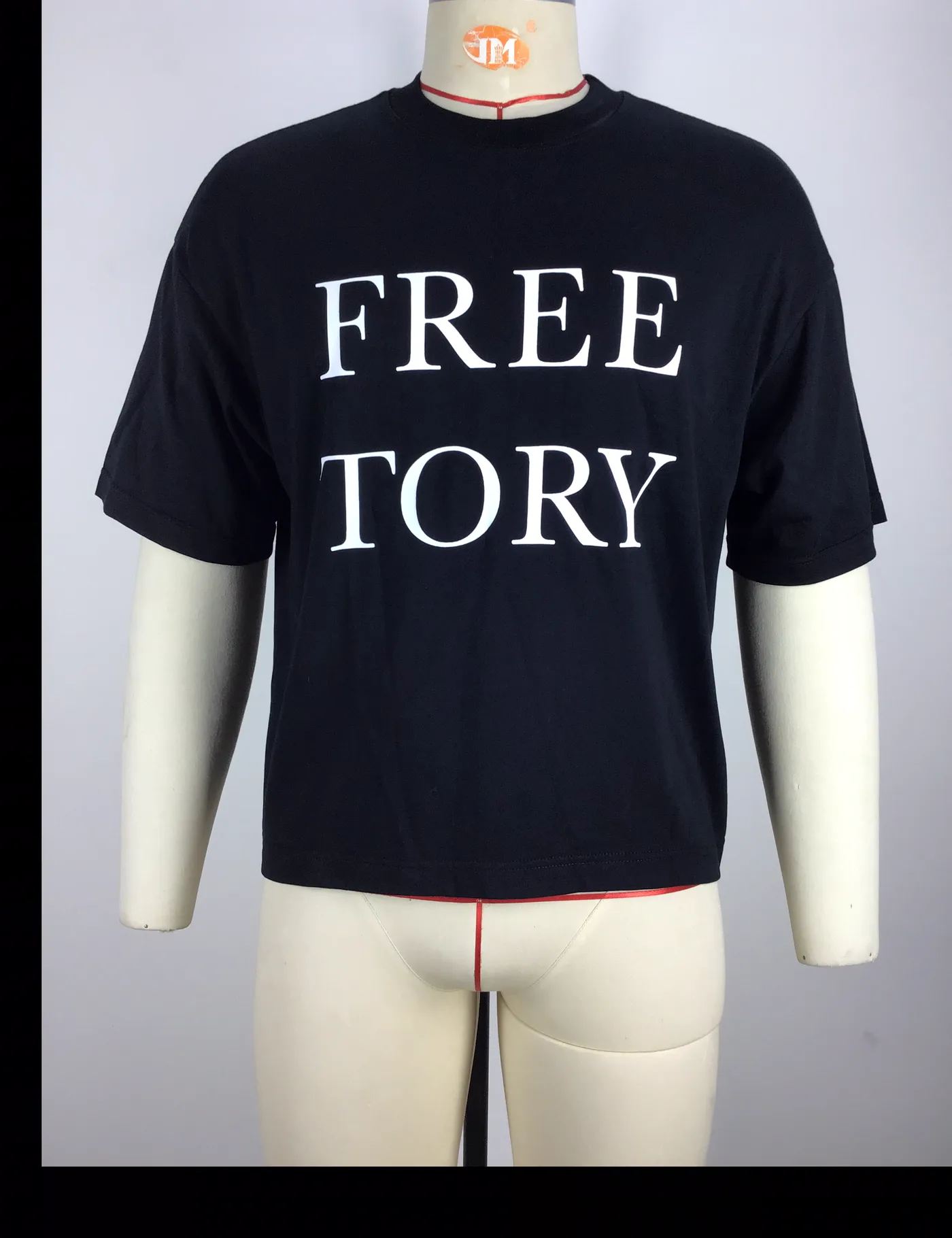 Actual black boxy fit graphic t-shirt sample shown from the front on a mannequin