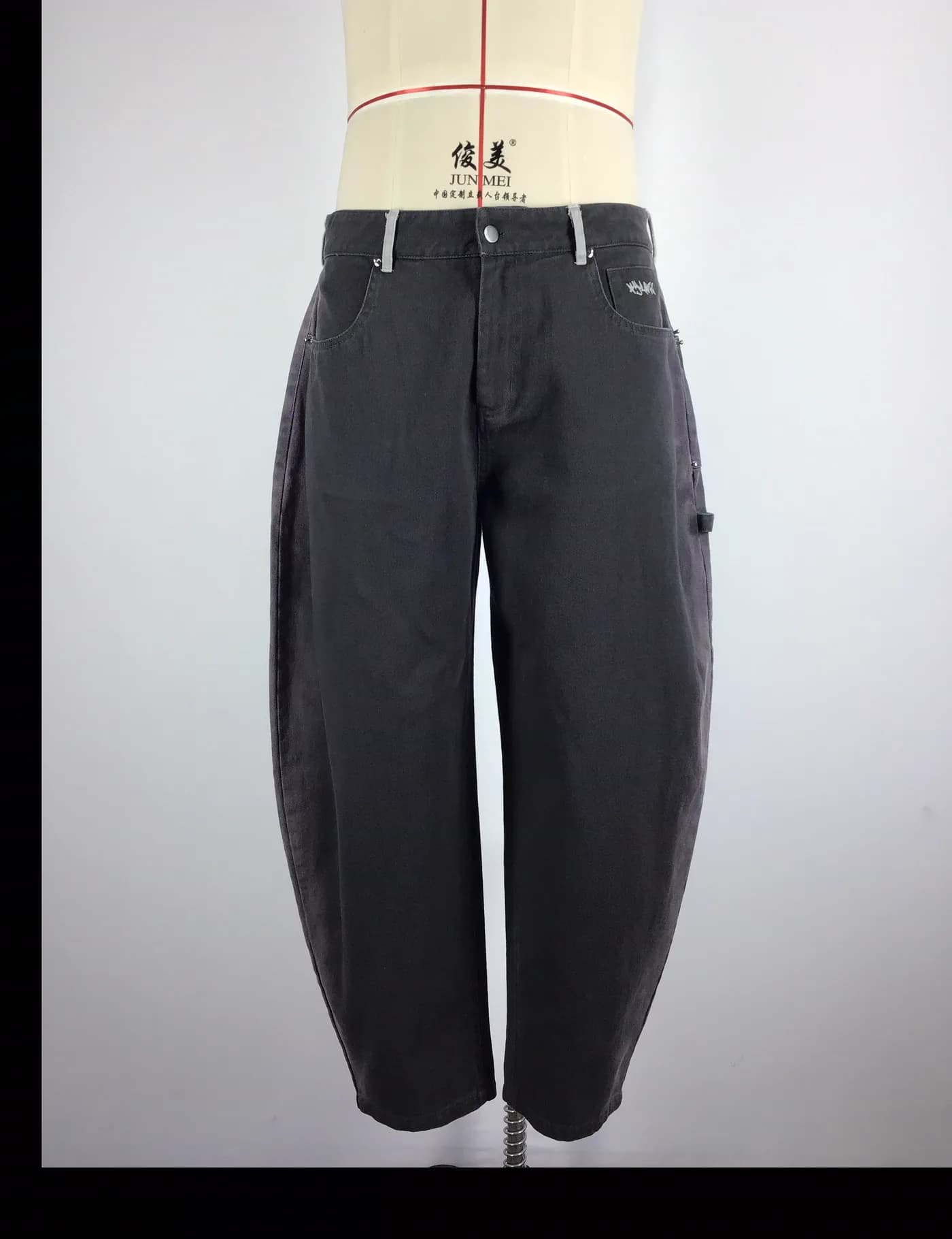 Actual charcoal washed workwear pants sample shown from the front on a mannequin