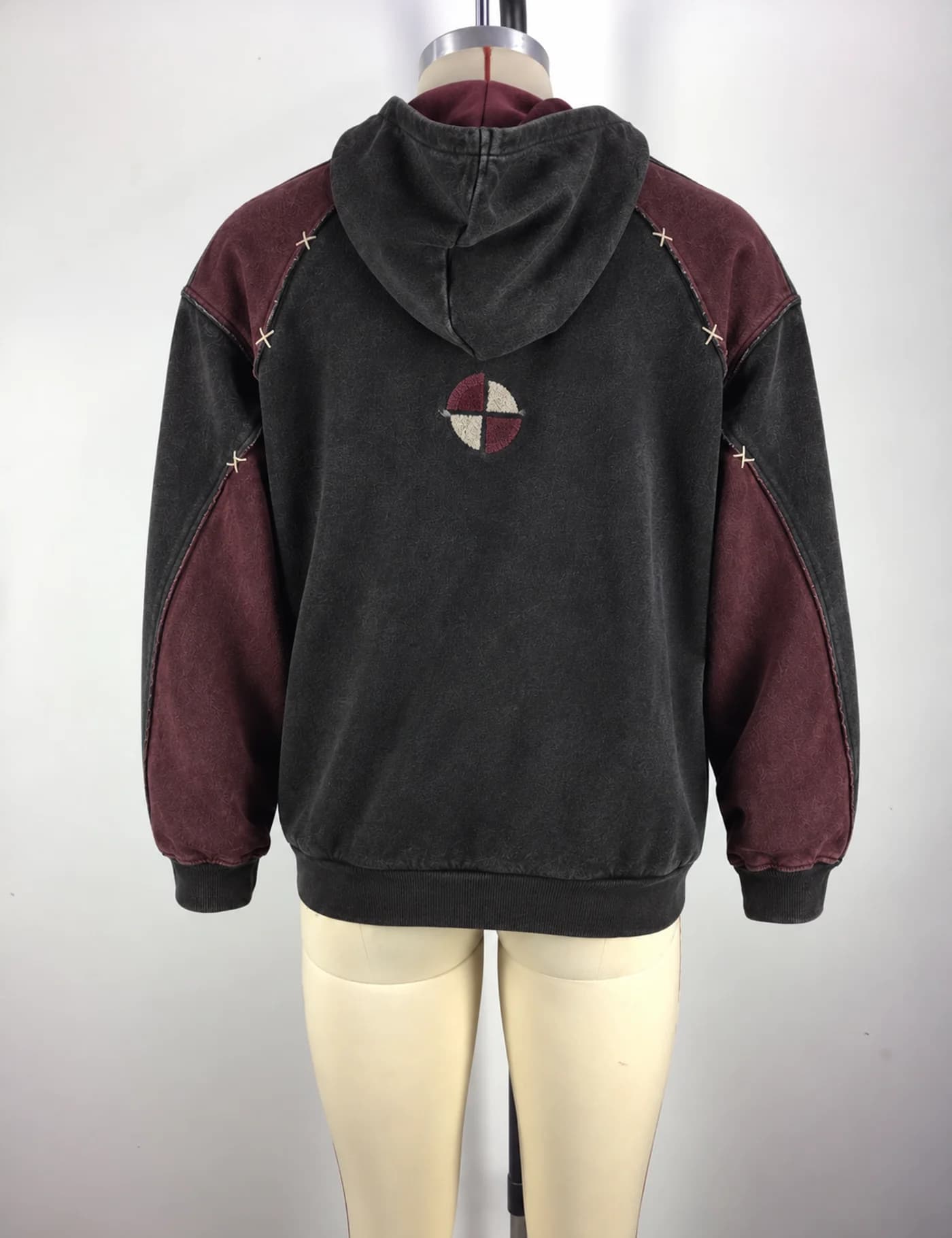 Actual color-block quarter-zip hoodie sample shown from the back on a mannequin