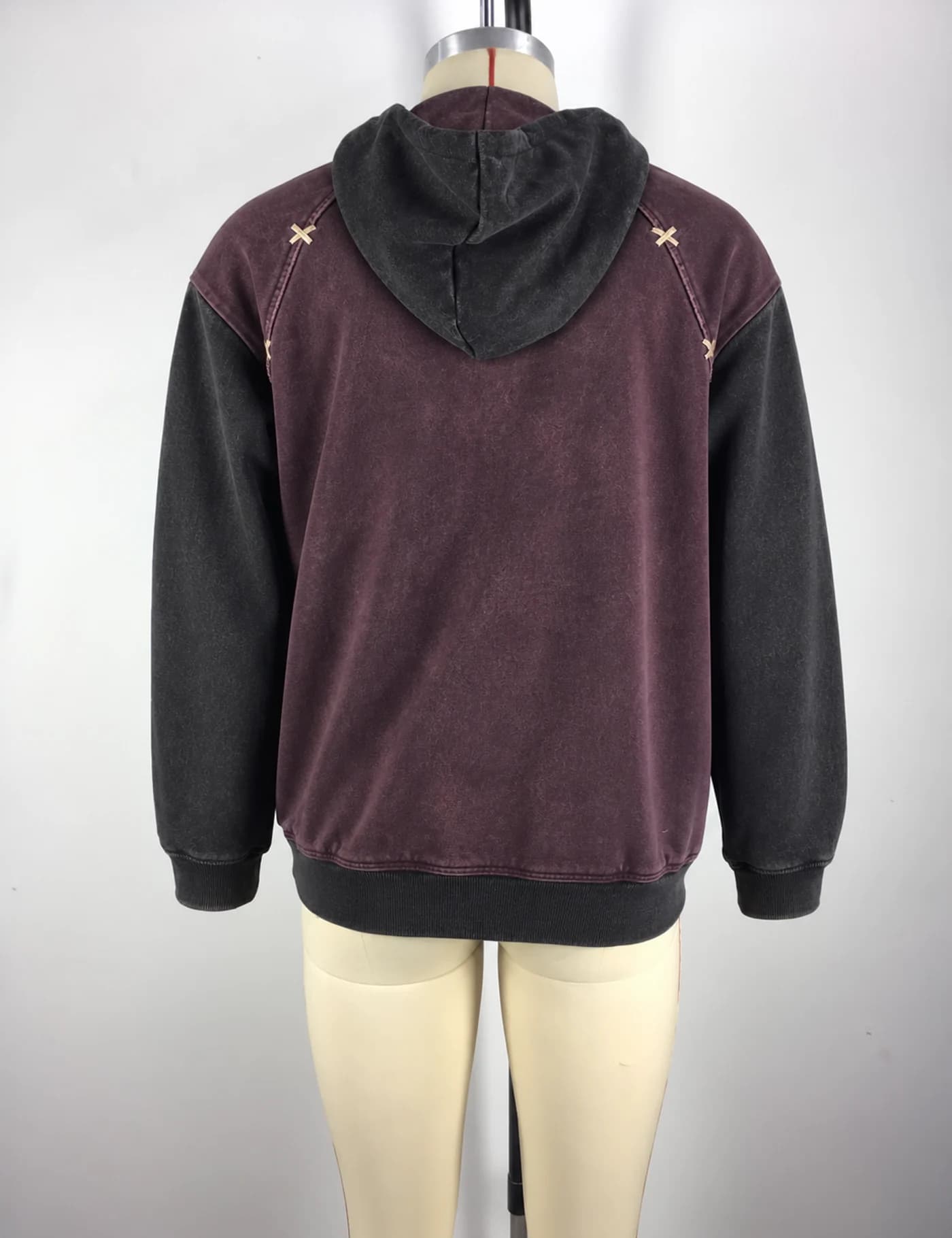 Actual color-block quarter-zip pullover hoodie sample shown from the back on a mannequin