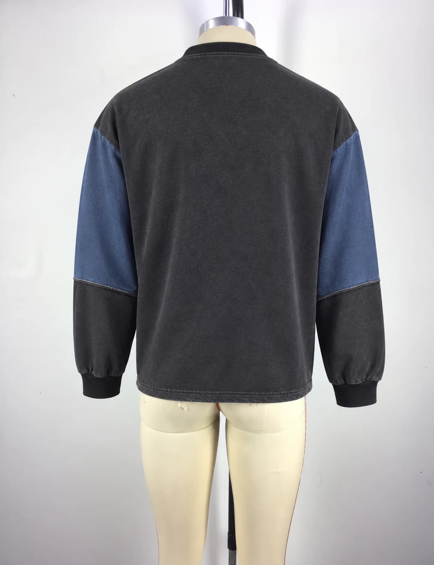 Actual color-block yoke crewneck sweatshirt sample shown from the back on a mannequin