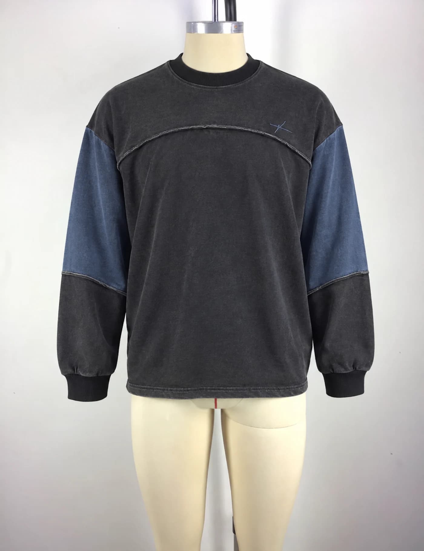 Actual color-block yoke crewneck sweatshirt sample shown from the front on a mannequin