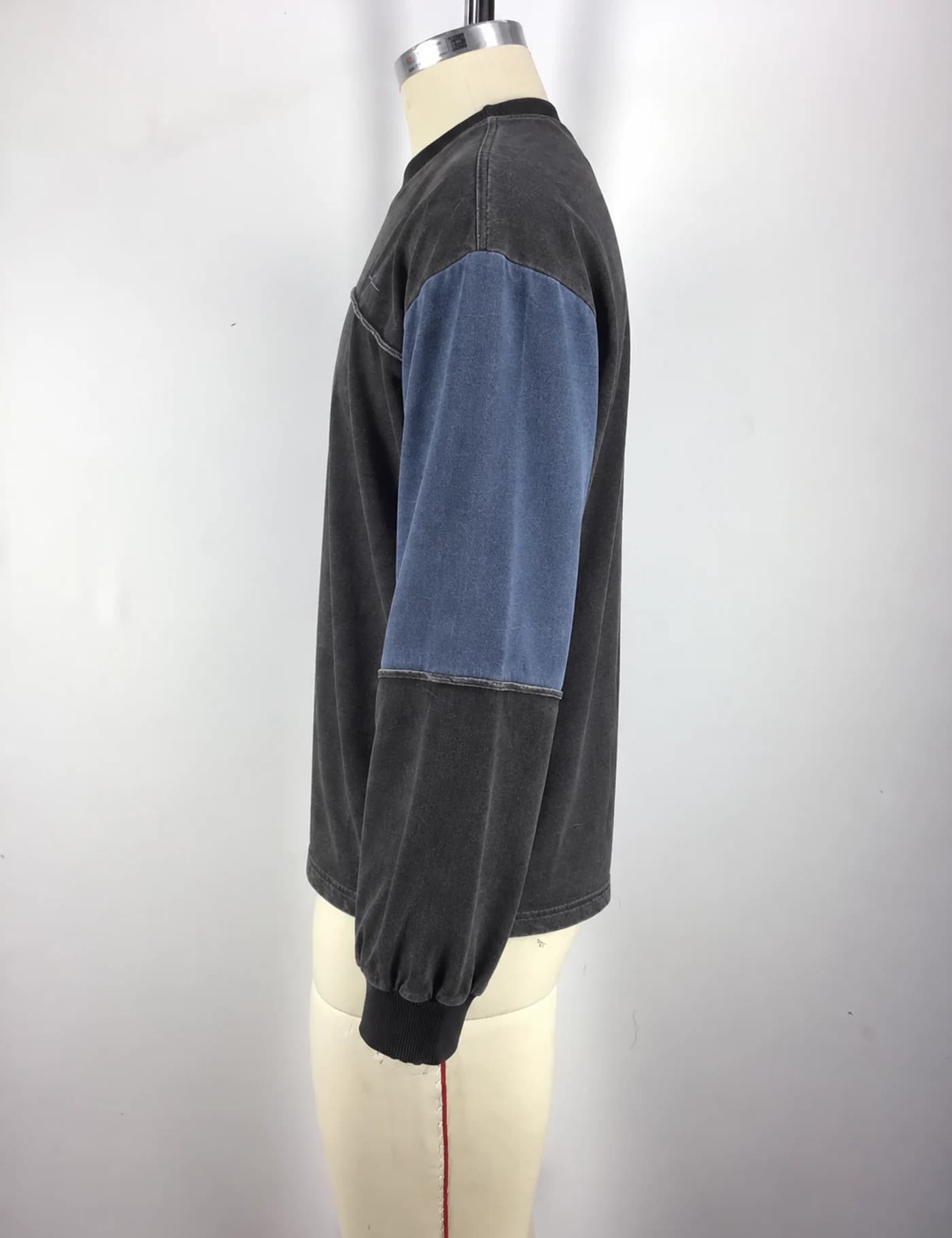 Actual color-block yoke crewneck sweatshirt sample shown from the side on a mannequin
