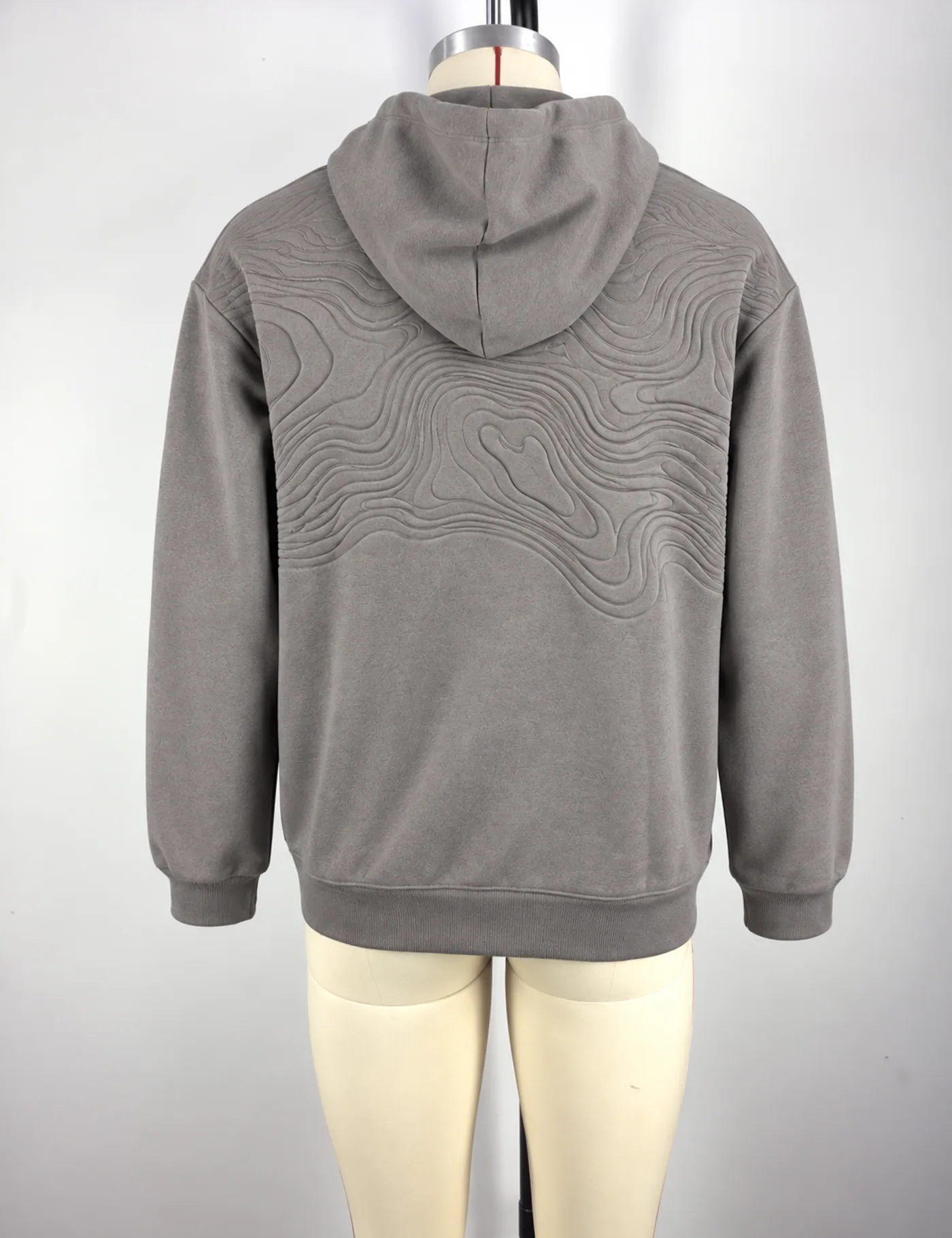 Actual contour-quilted pullover hoodie sample shown from the back on a mannequin