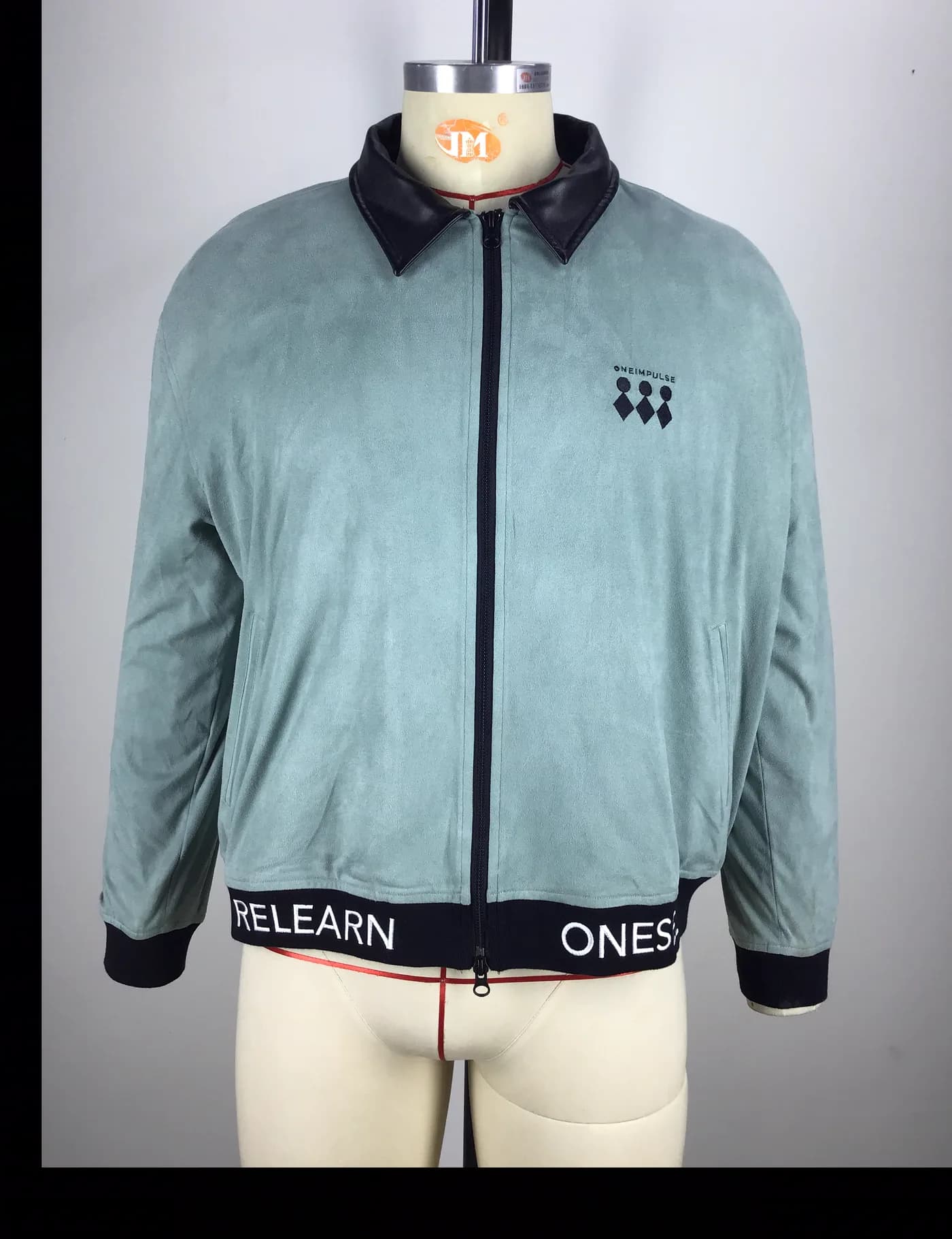 Actual contrast collar bomber jacket sample shown from the front on a mannequin