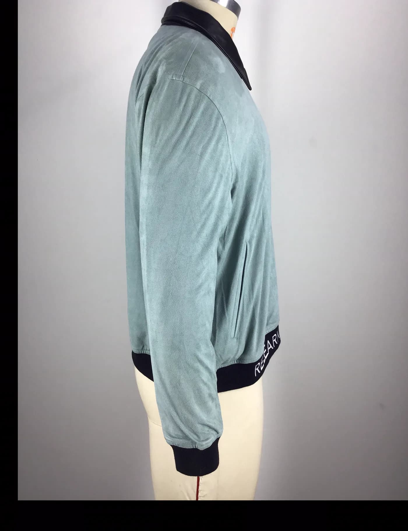 Actual contrast collar bomber jacket sample shown from the side on a mannequin