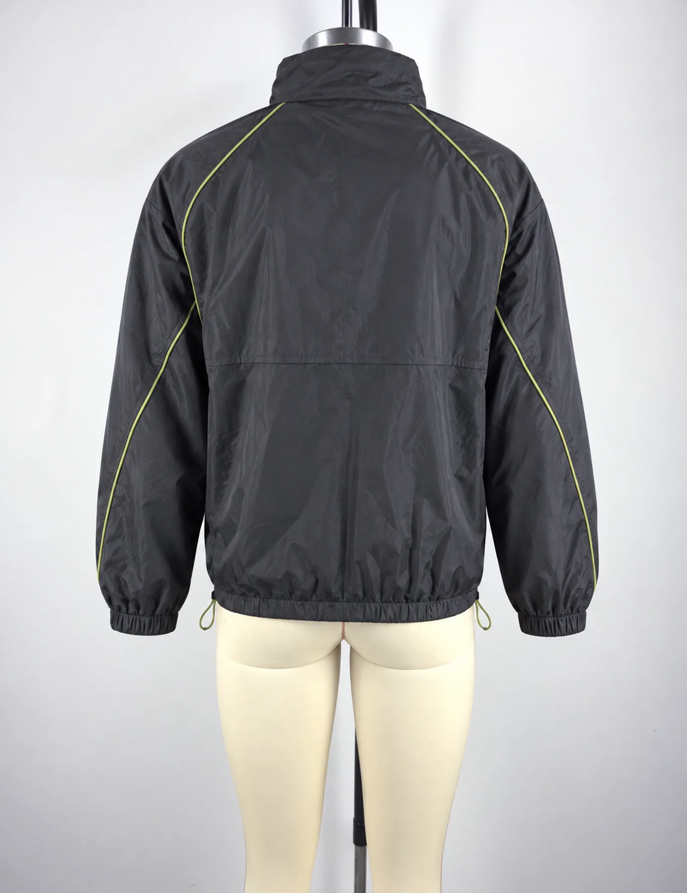 Actual contrast-piping half-zip windbreaker sample shown from the back on a mannequin