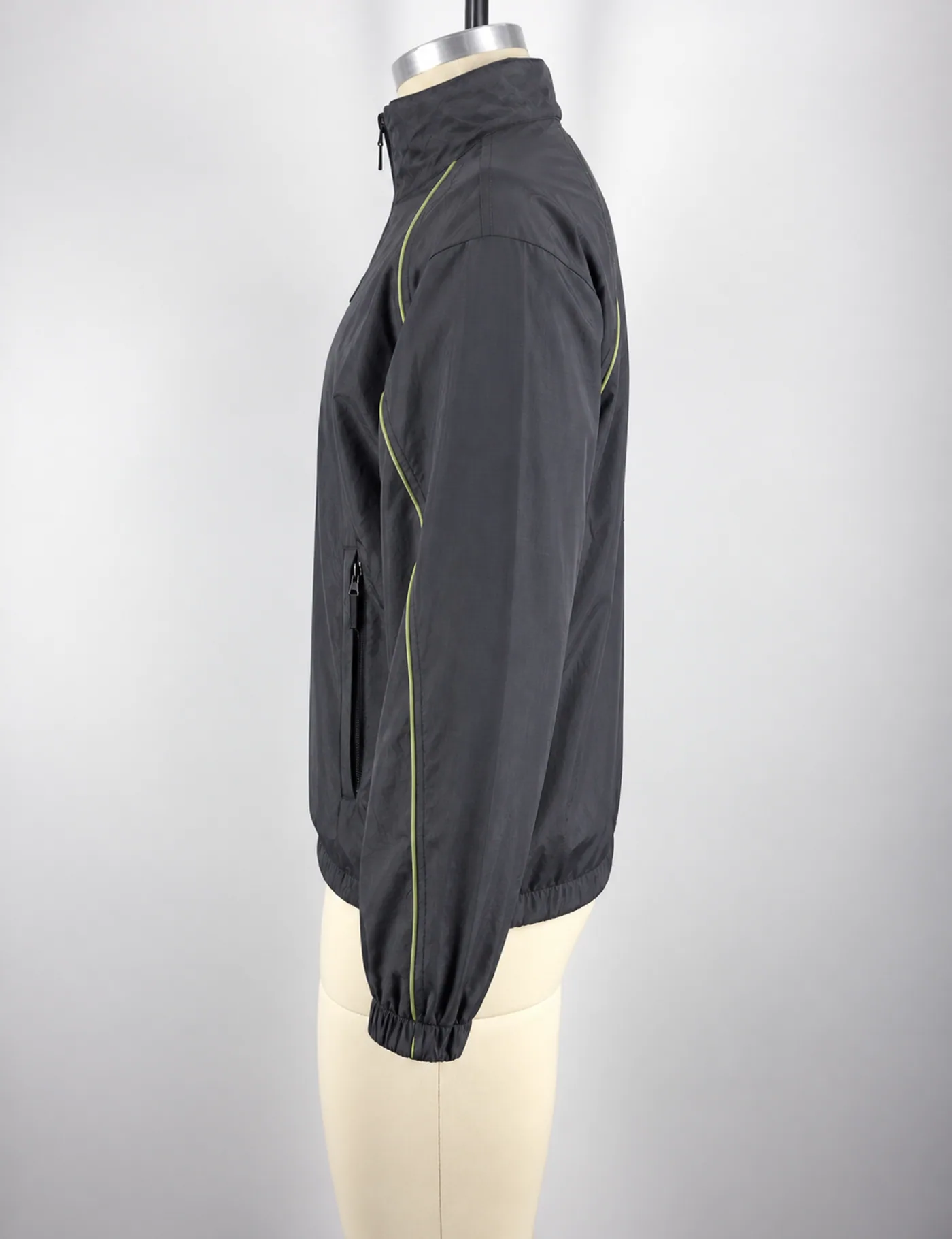 Actual contrast-piping half-zip windbreaker sample shown from the side on a mannequin