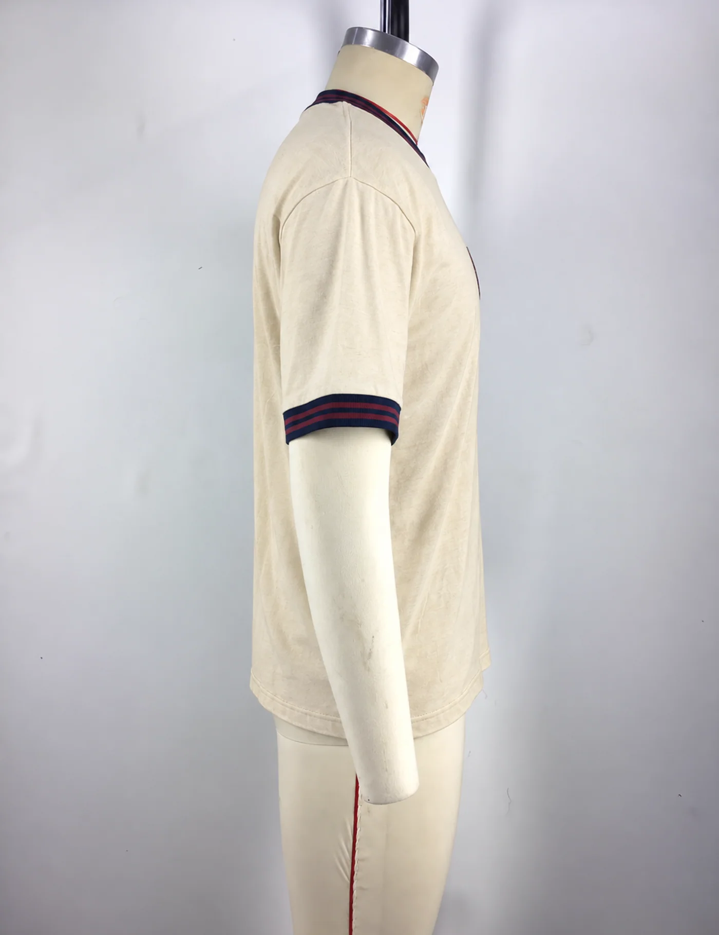 Actual chenille embroidery ringer t-shirt sample shown from the side on a mannequin