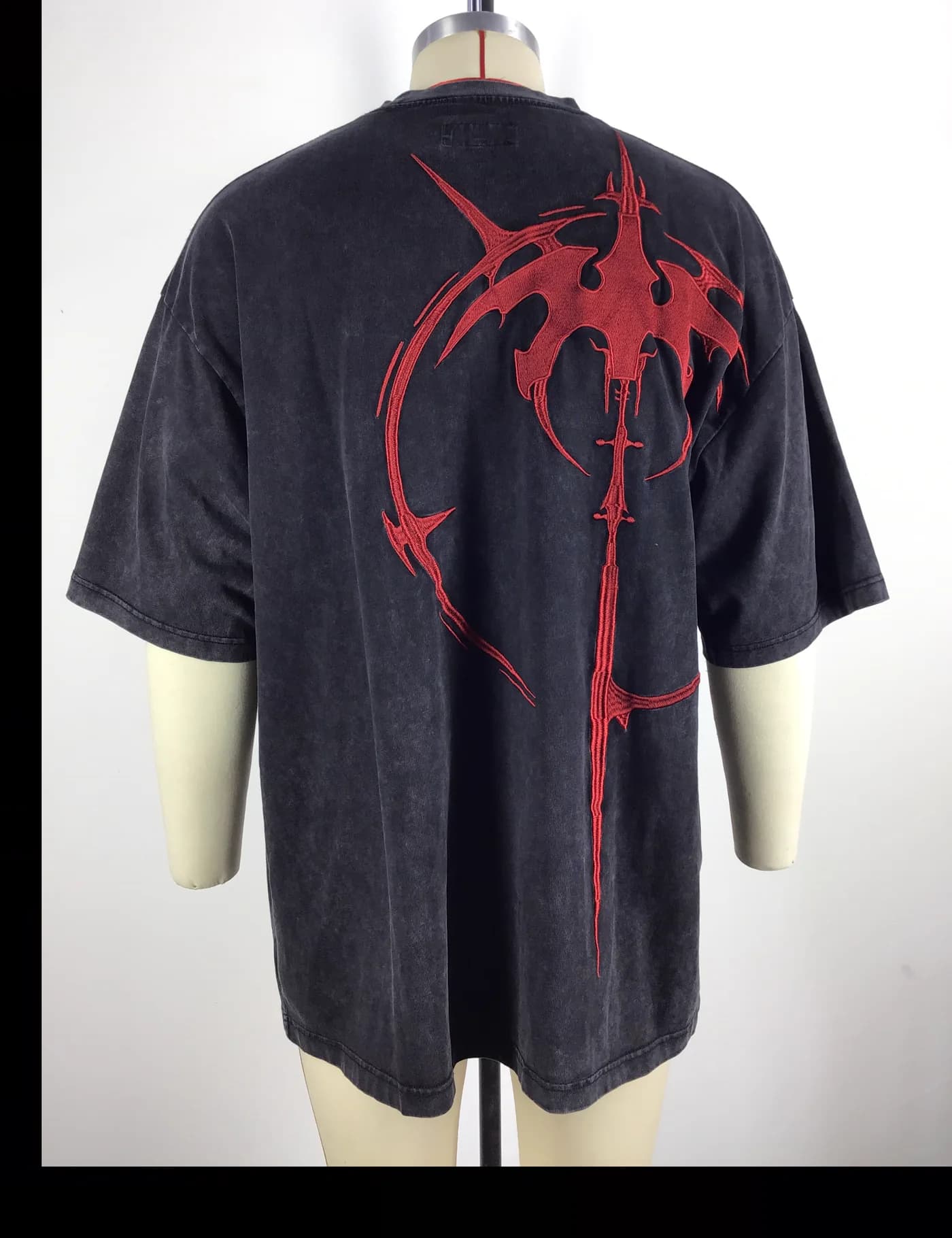 Actual embroidered oversized t-shirt sample shown from the back on a mannequin