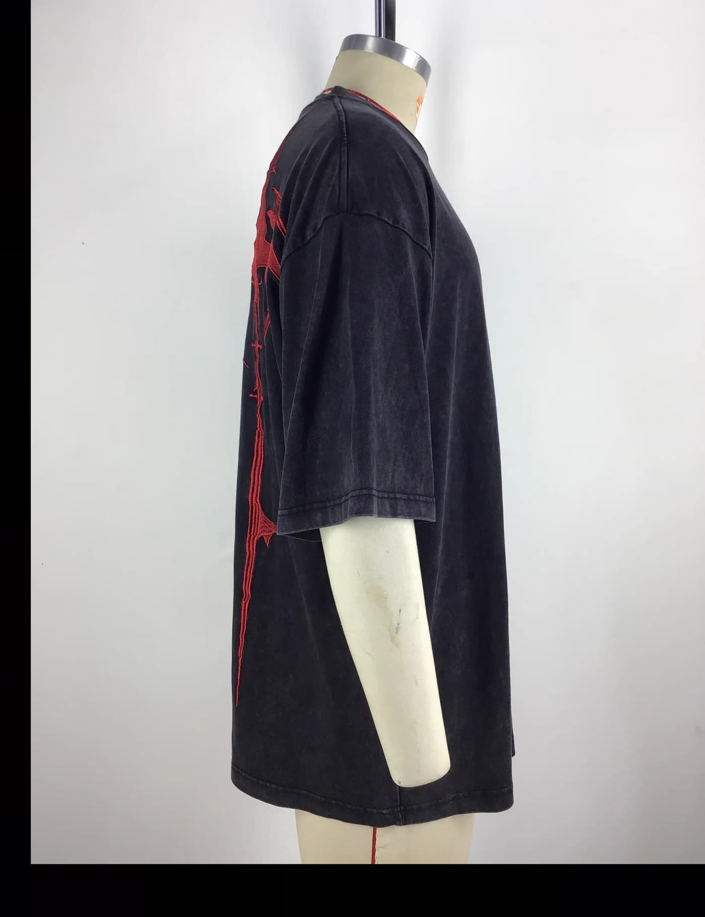 Actual embroidered oversized t-shirt sample shown from the side on a mannequin