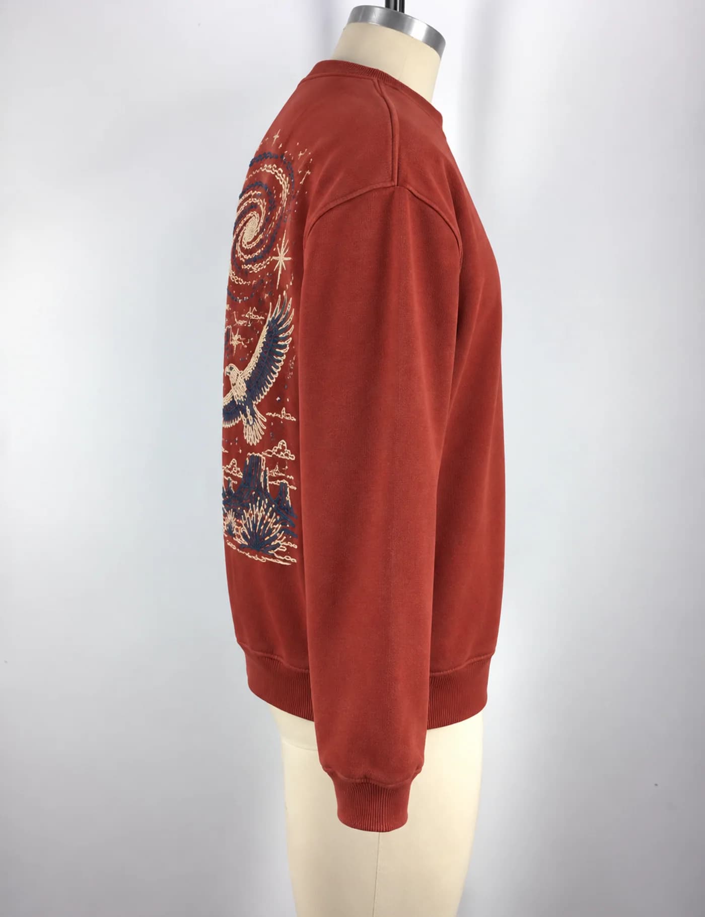 Actual large embroidery crewneck sweatshirt sample shown from the side on a mannequin