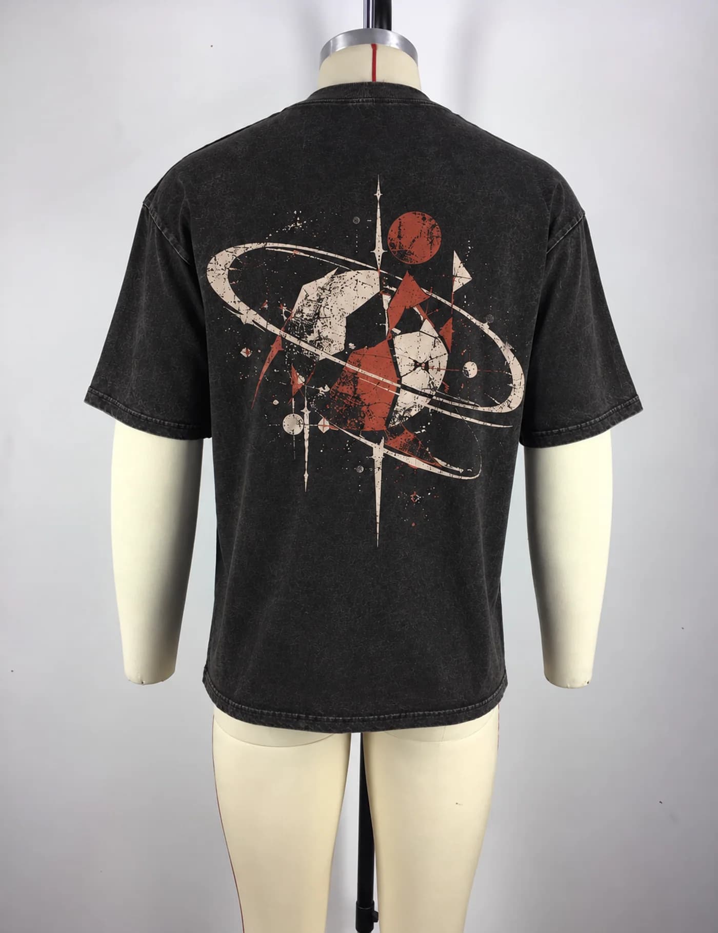 Actual oversized cracked graphic t-shirt sample shown from the back on a mannequin