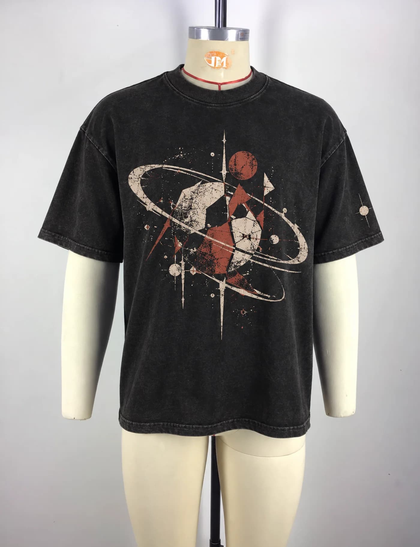 Actual oversized cracked graphic t-shirt sample shown from the front on a mannequin