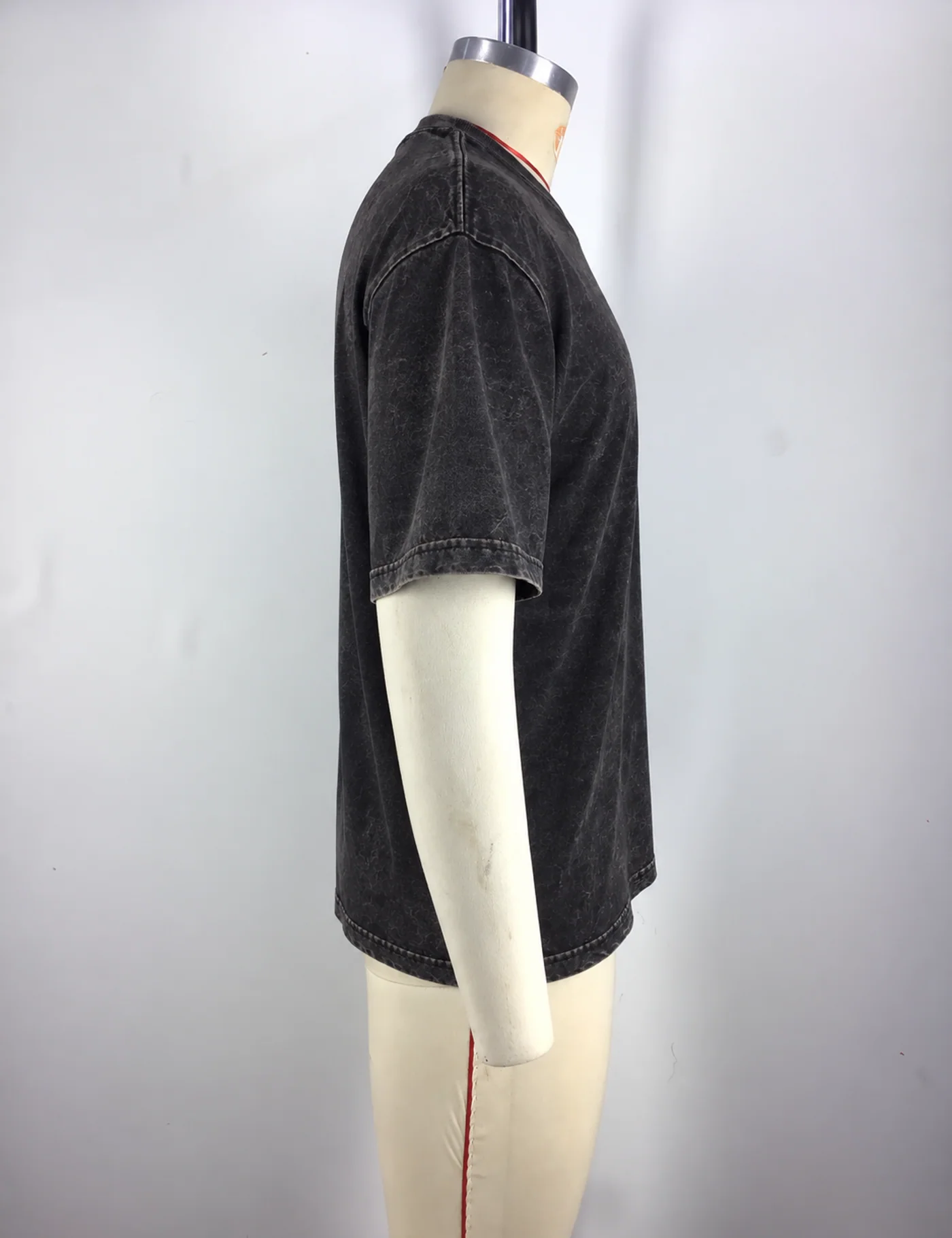 Actual vintage cracked print t-shirt sample shown from the side on a mannequin