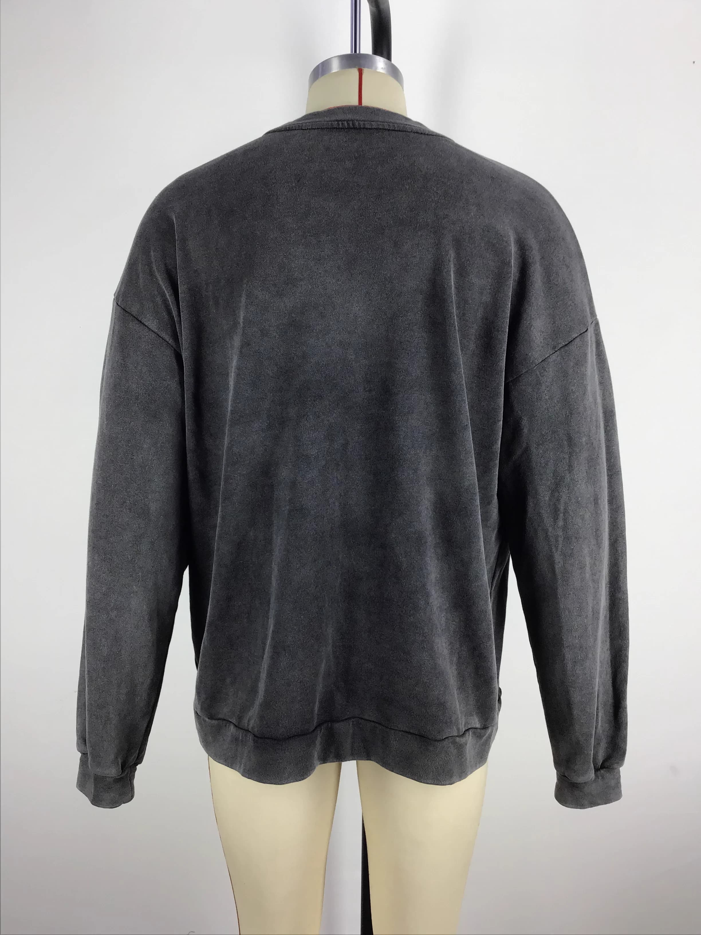Actual charcoal washed crewneck sweatshirt sample shown from the back on a mannequin