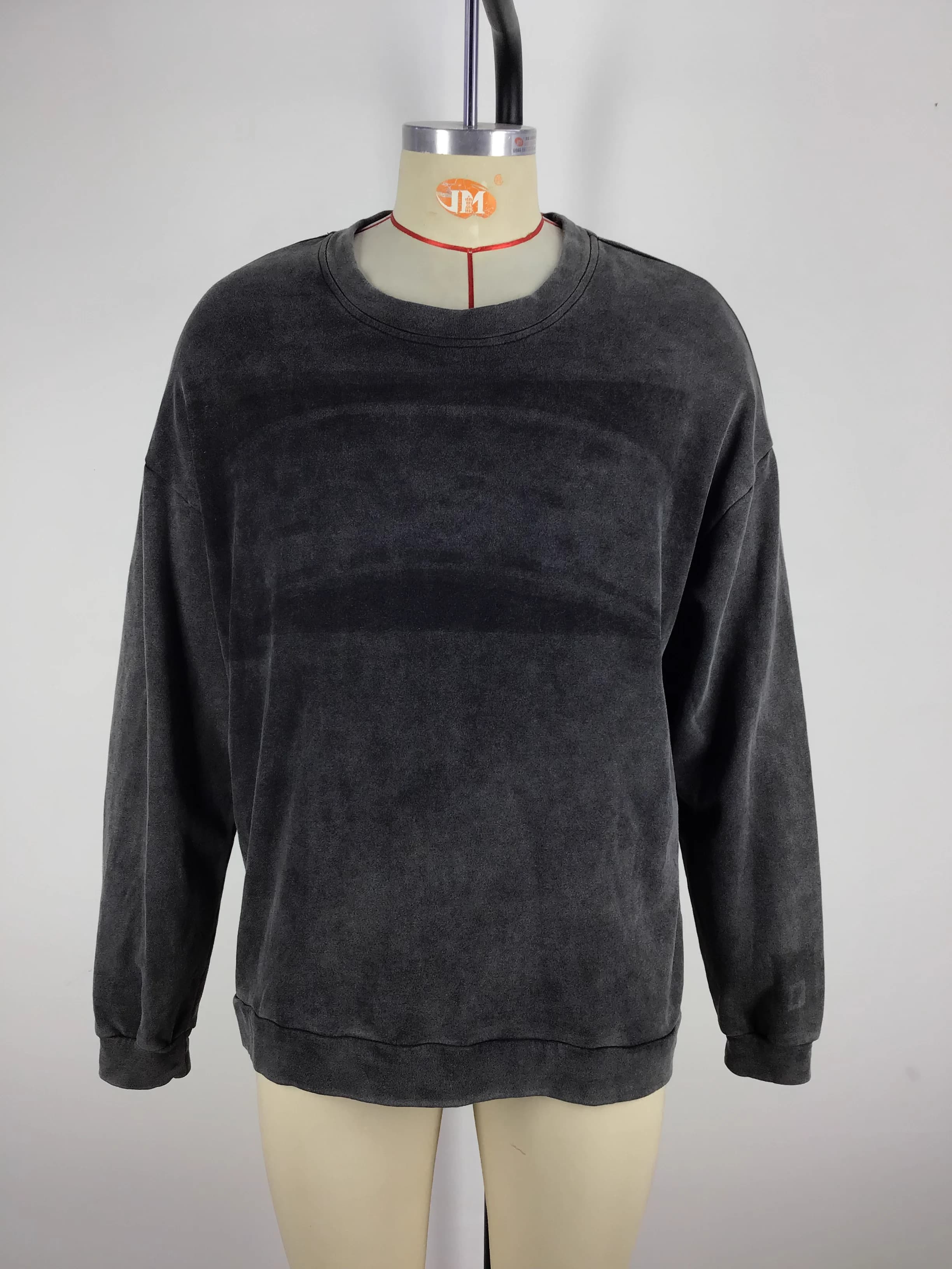 Actual charcoal washed crewneck sweatshirt sample shown from the front on a mannequin