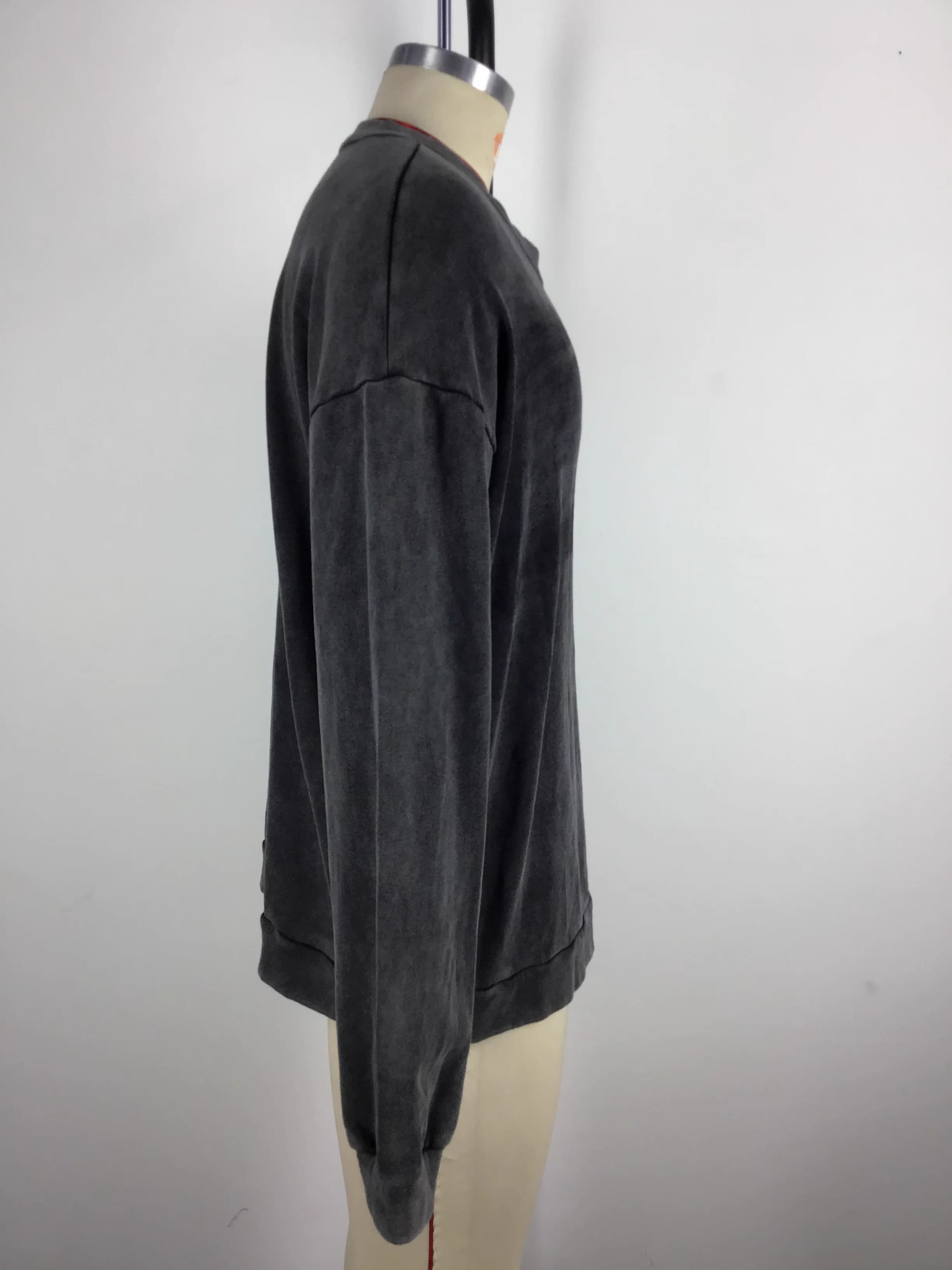 Actual washed crewneck sweatshirt sample showing the drop shoulder and relaxed side silhouette