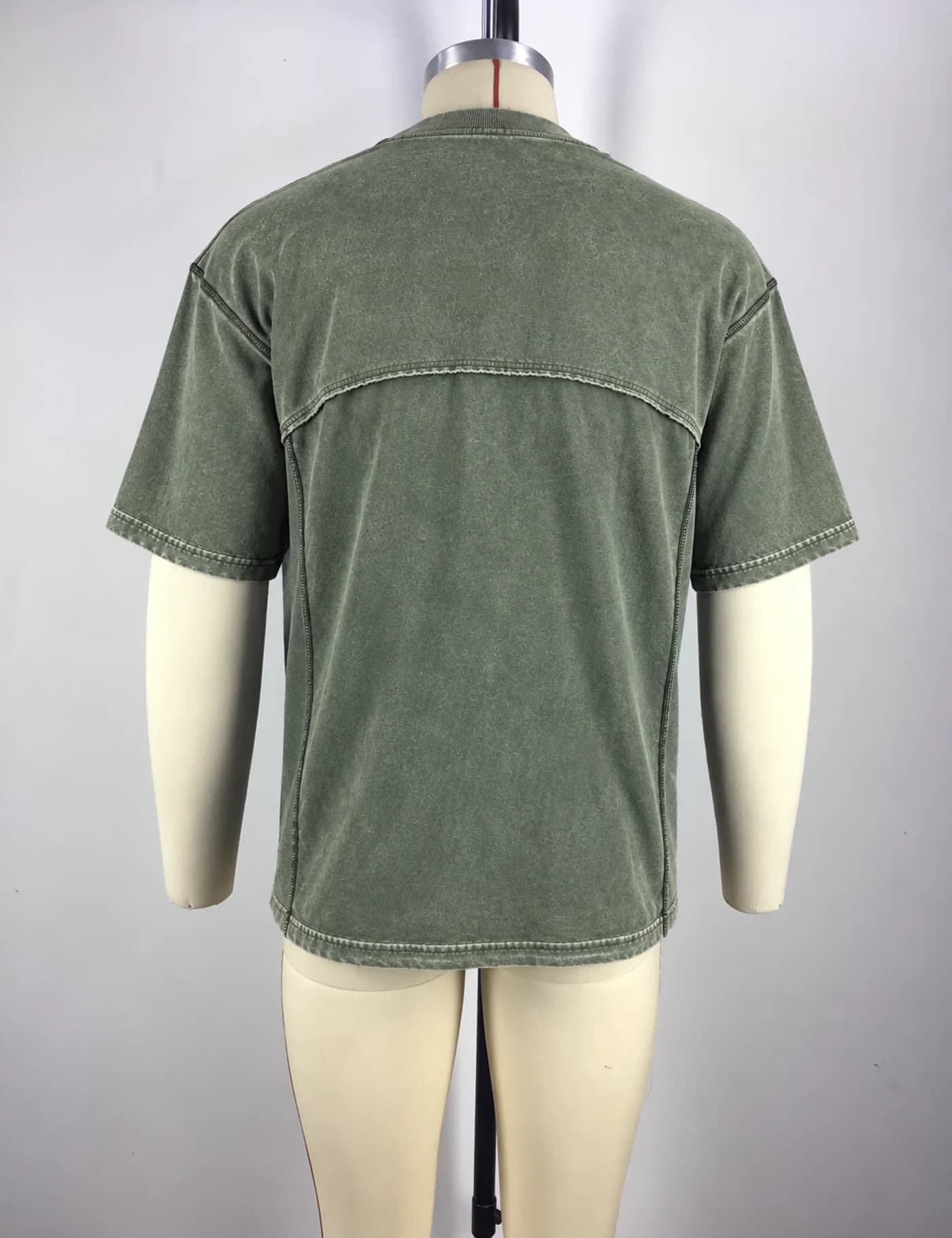 Actual washed panel seam t-shirt sample shown from the back on a mannequin