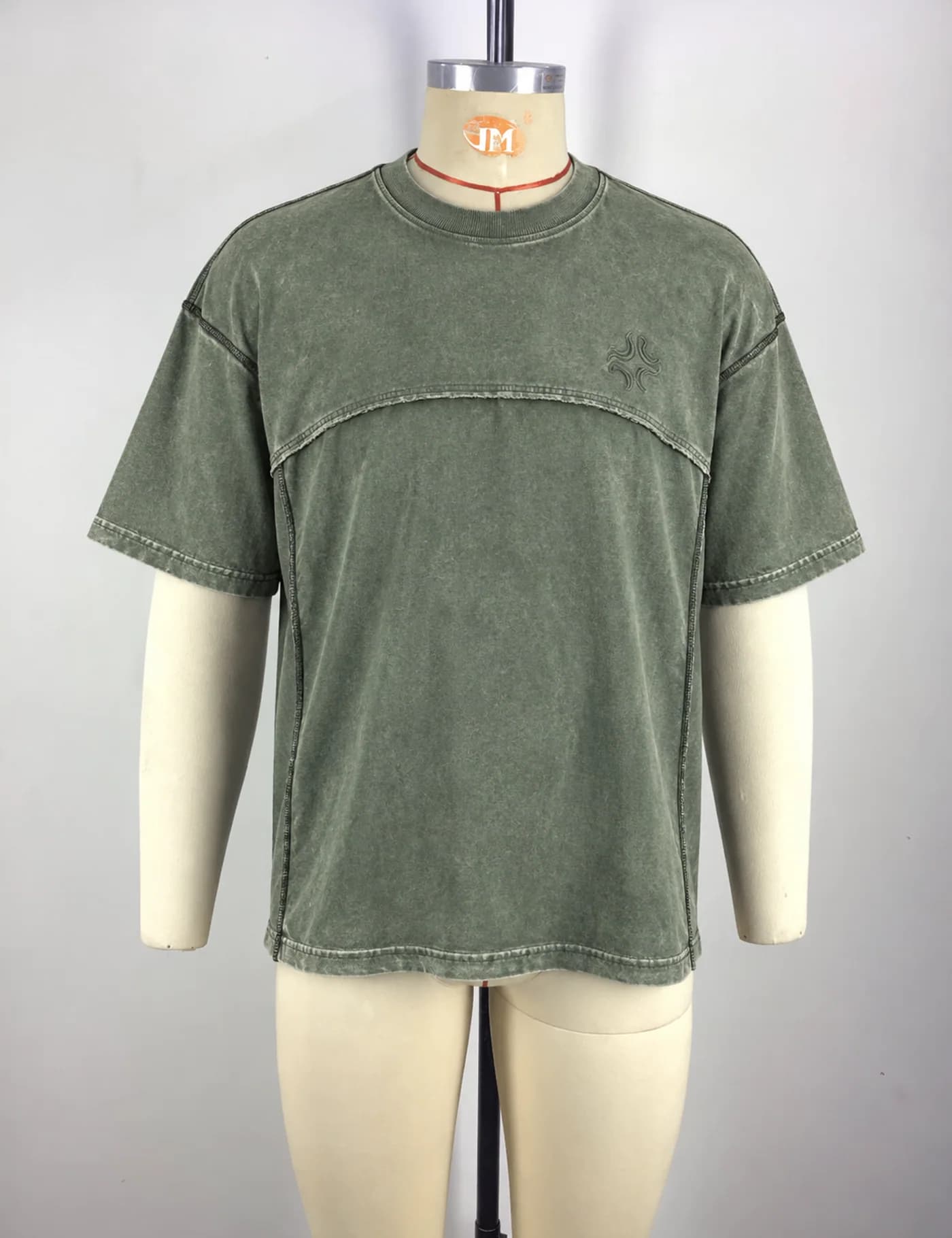 Actual washed panel seam t-shirt sample shown from the front on a mannequin