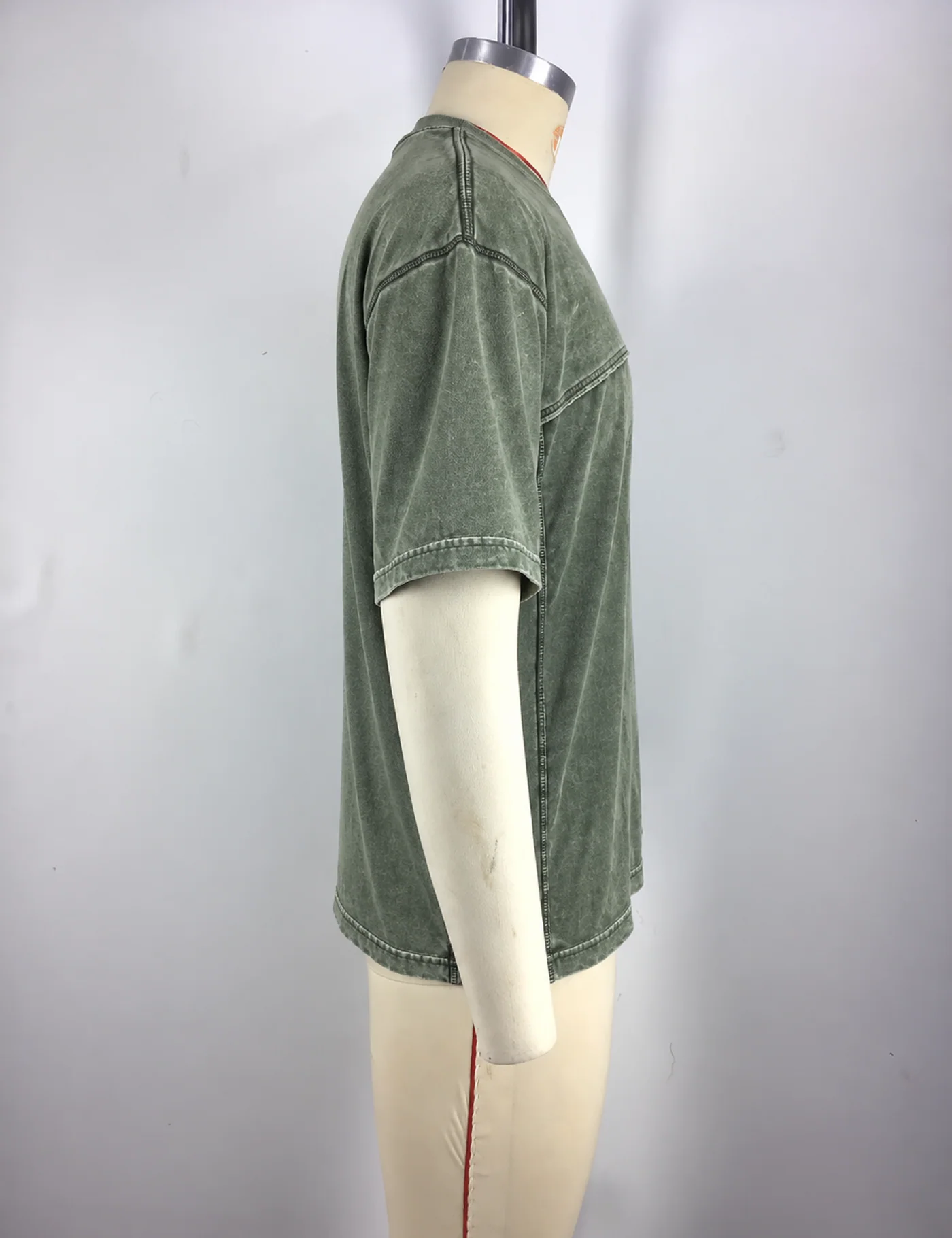 Actual washed panel seam t-shirt sample shown from the side on a mannequin