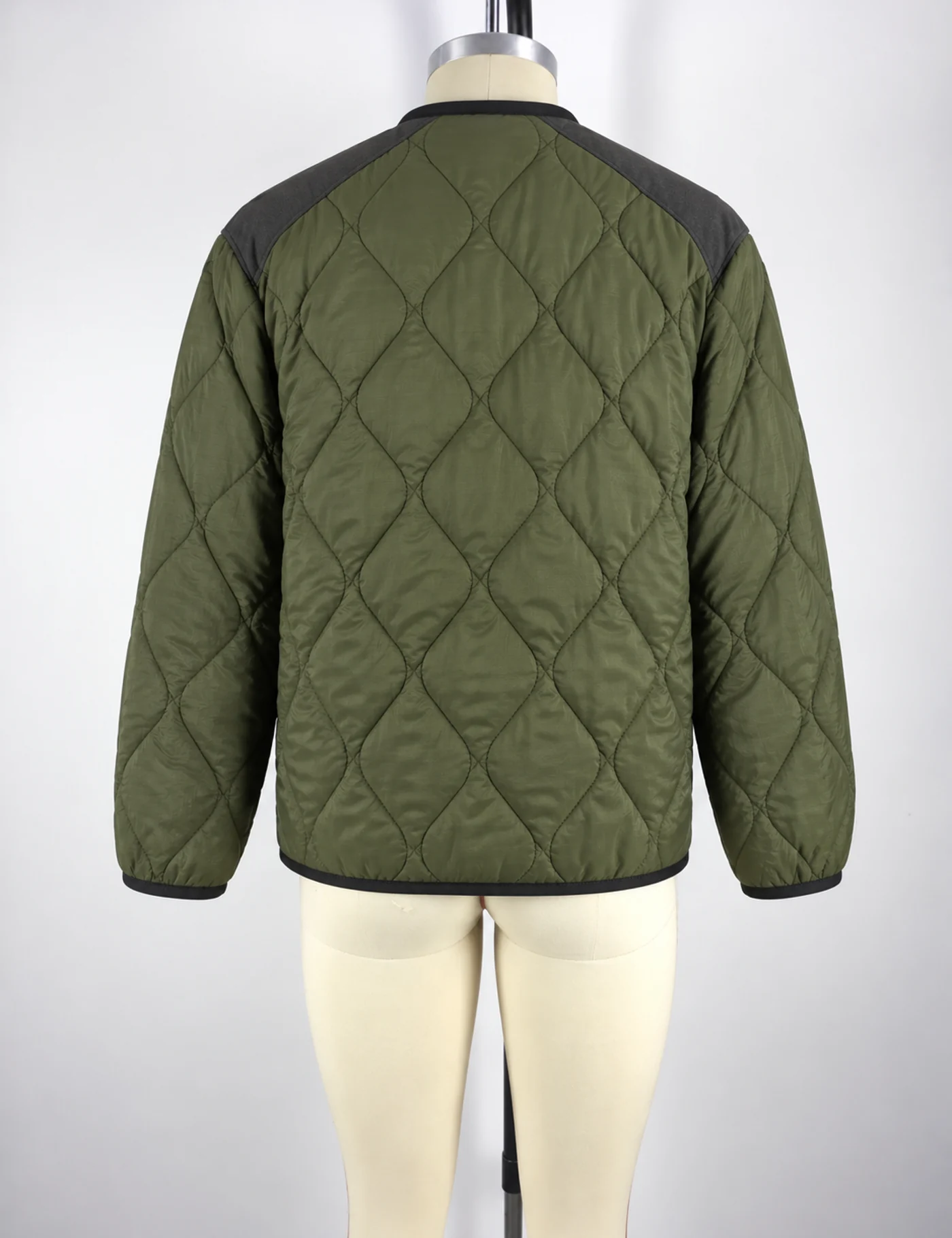 Actual diamond-quilted liner jacket sample shown from the back on a mannequin
