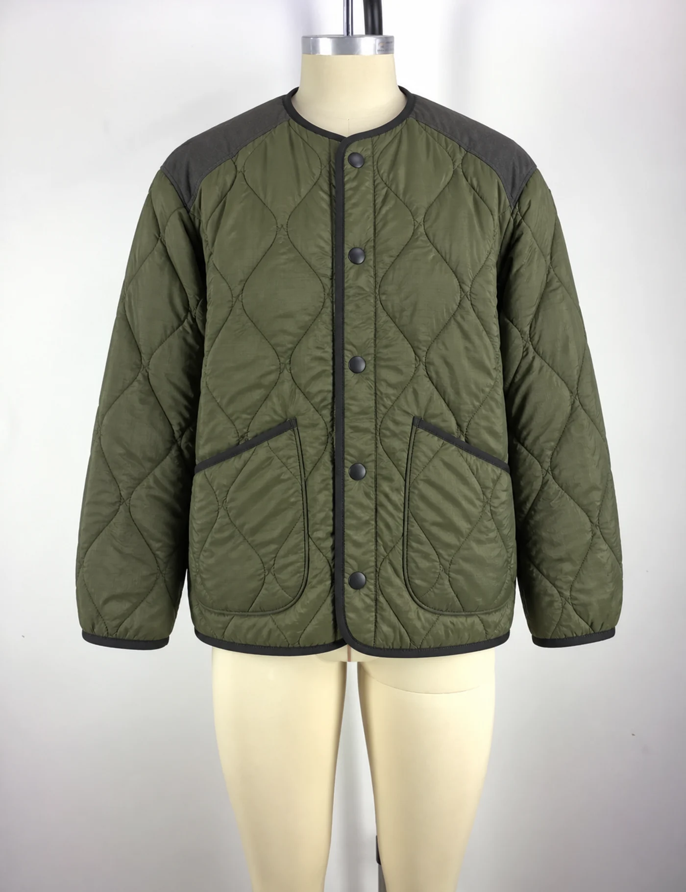 Actual diamond-quilted liner jacket sample shown from the front on a mannequin