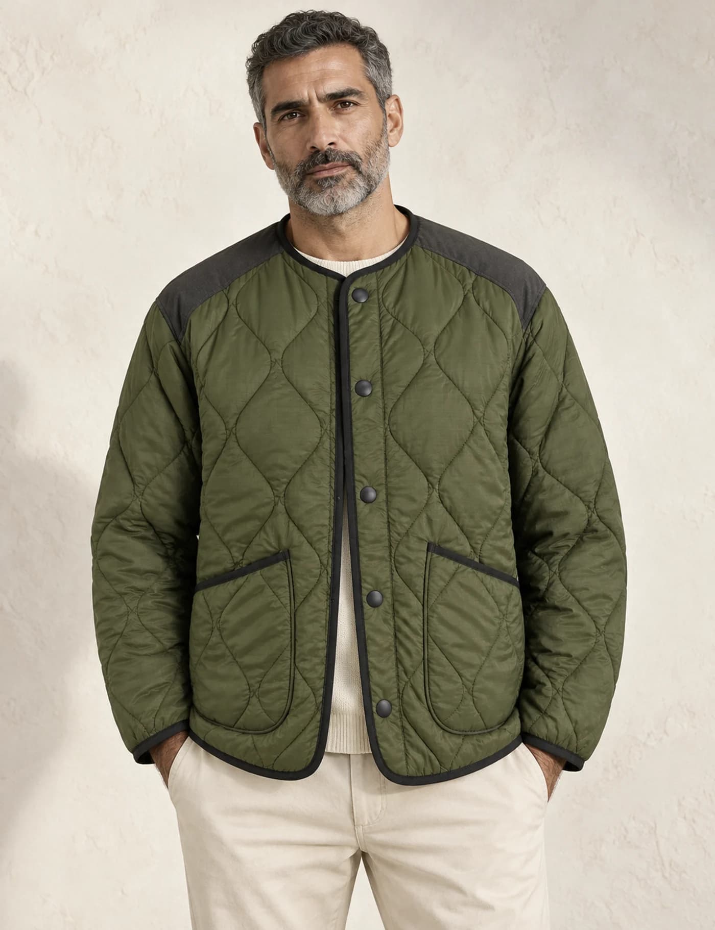 Mature Middle Eastern male model wearing an olive diamond-quilted liner jacket