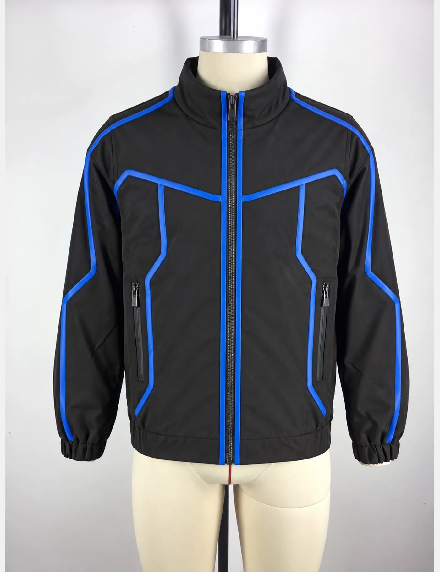 Actual electric-blue piping technical track jacket sample shown from the front on a mannequin