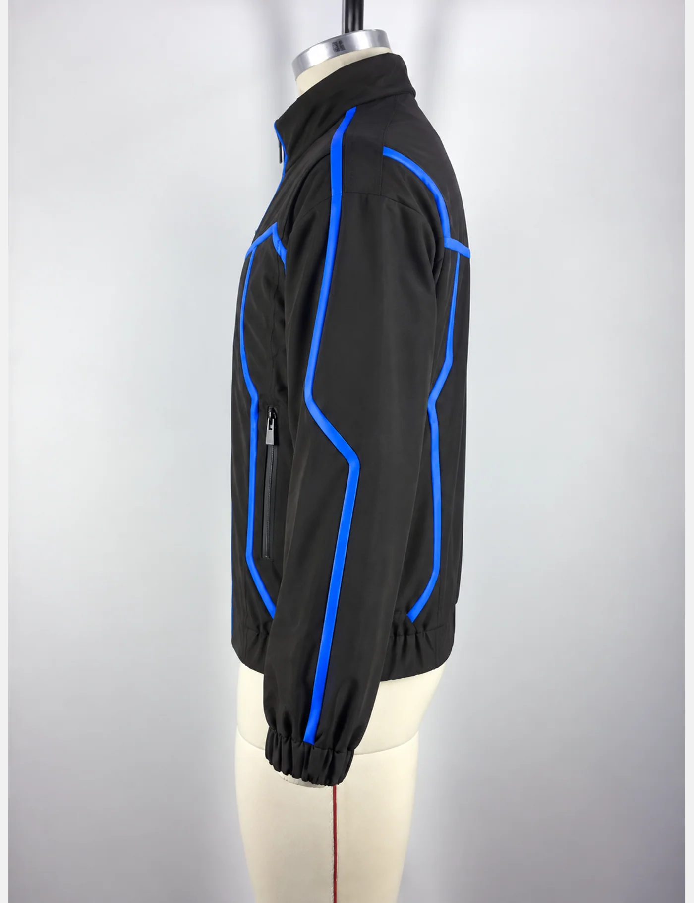 Actual electric-blue piping technical track jacket sample shown from the side on a mannequin
