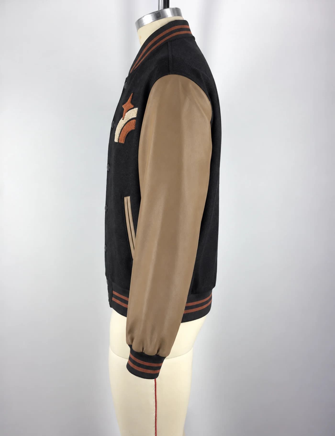 Actual embroidered patch varsity jacket sample shown from the side on a mannequin