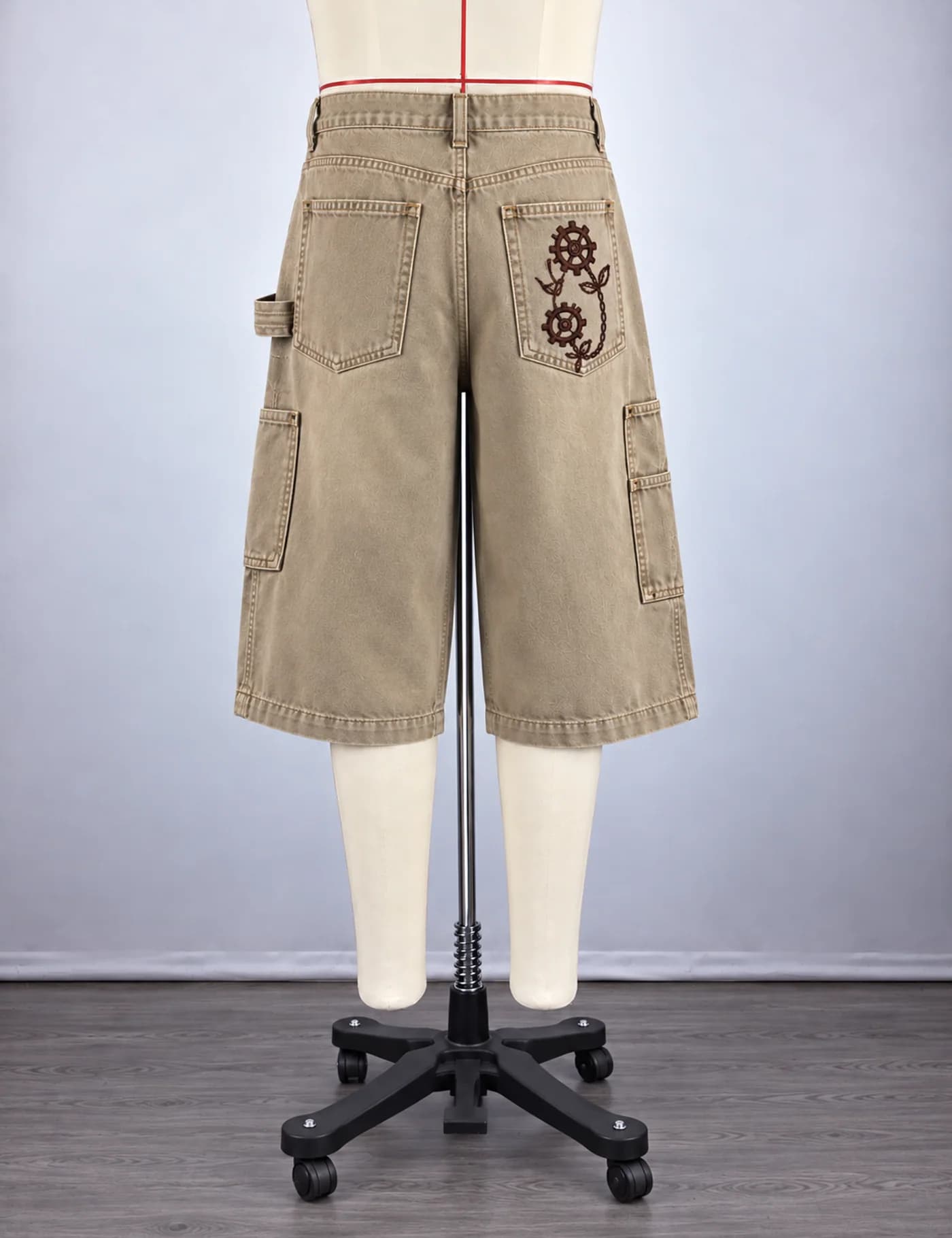 Actual embroidered utility cargo shorts sample shown from the back on a mannequin