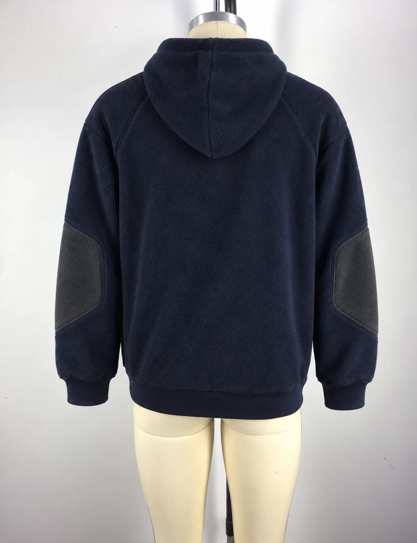 Actual fleece-panel half-zip hoodie sample shown from the back on a mannequin