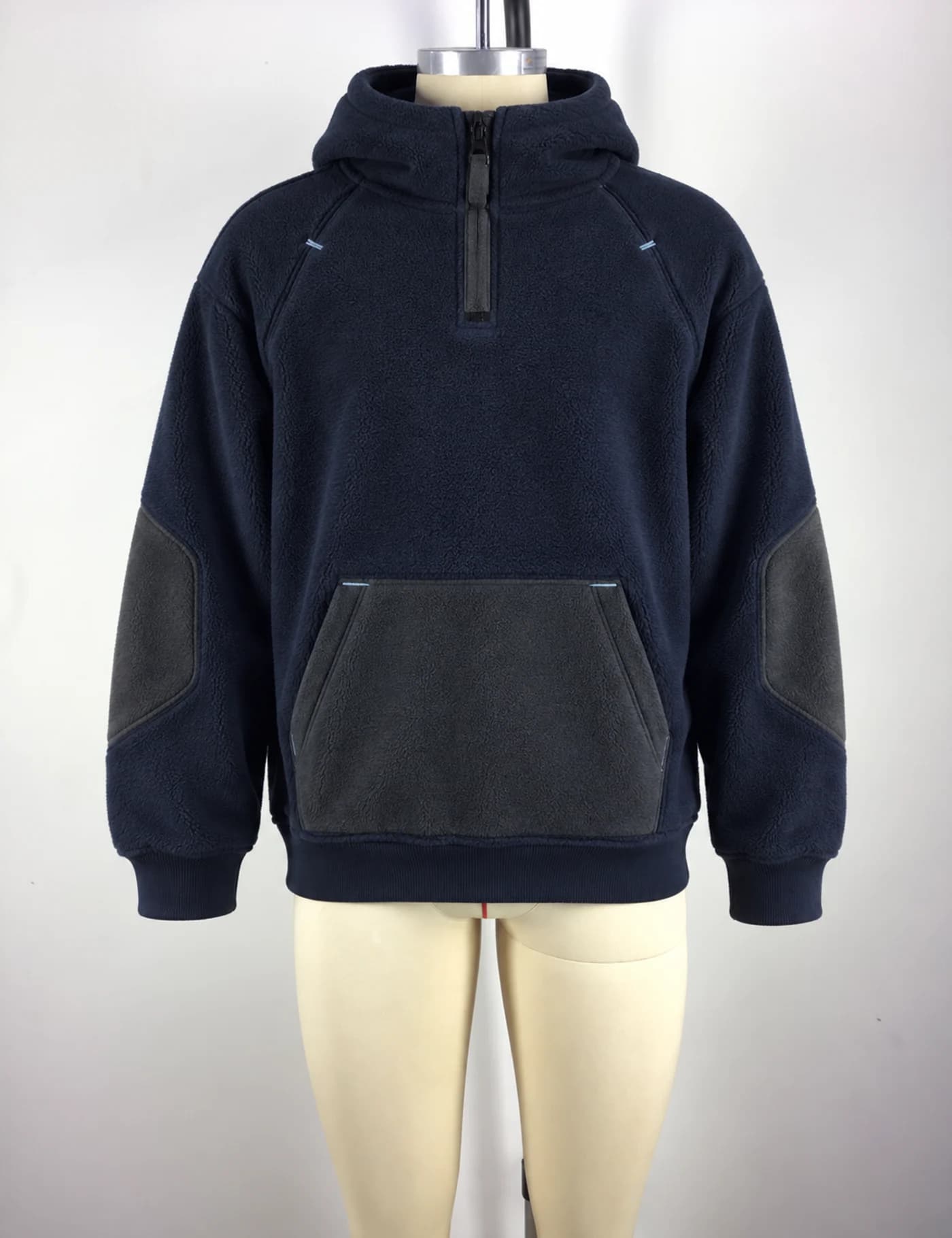 Actual fleece-panel half-zip hoodie sample shown from the front on a mannequin