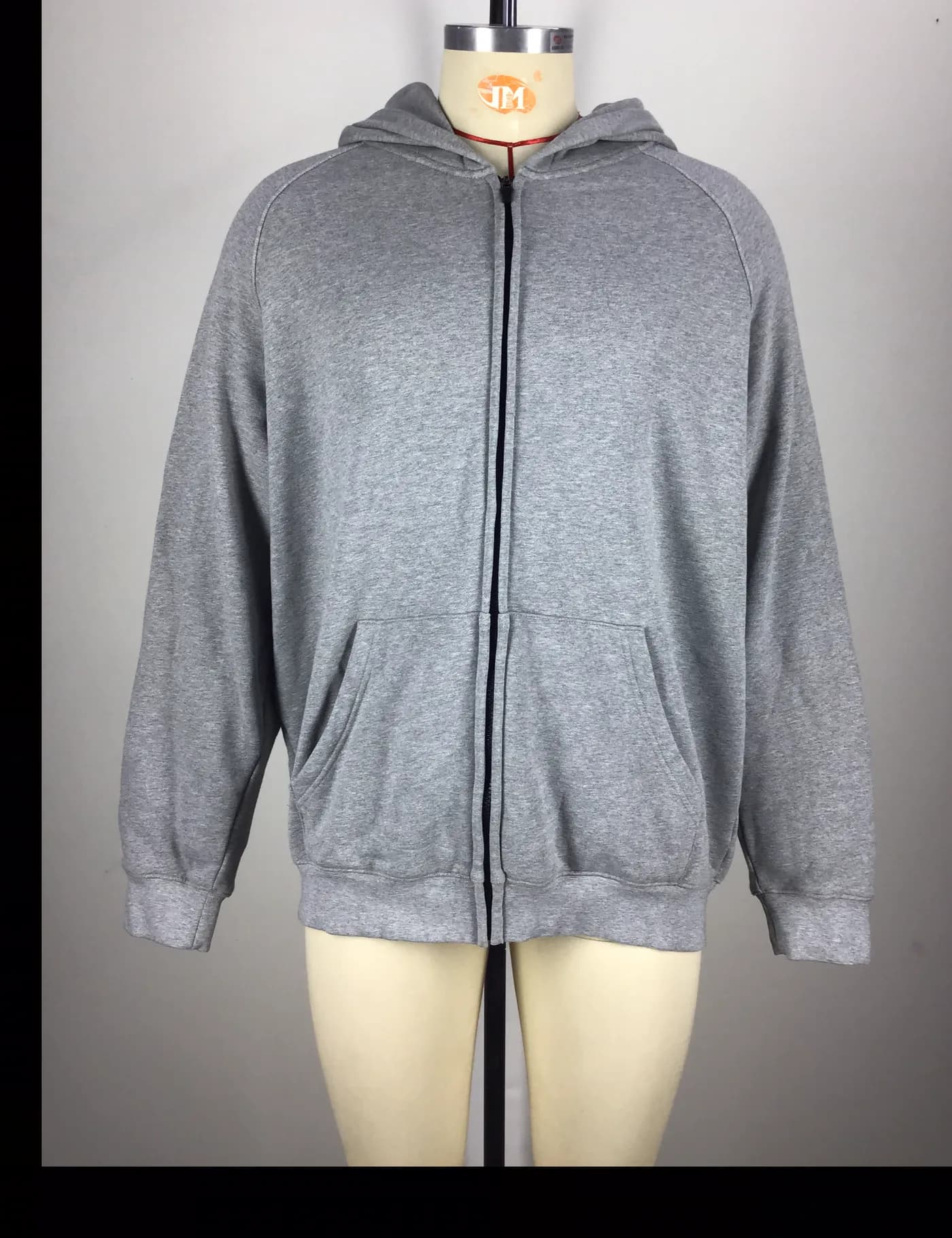 Actual gray full-zip hoodie sample shown from the front on a mannequin