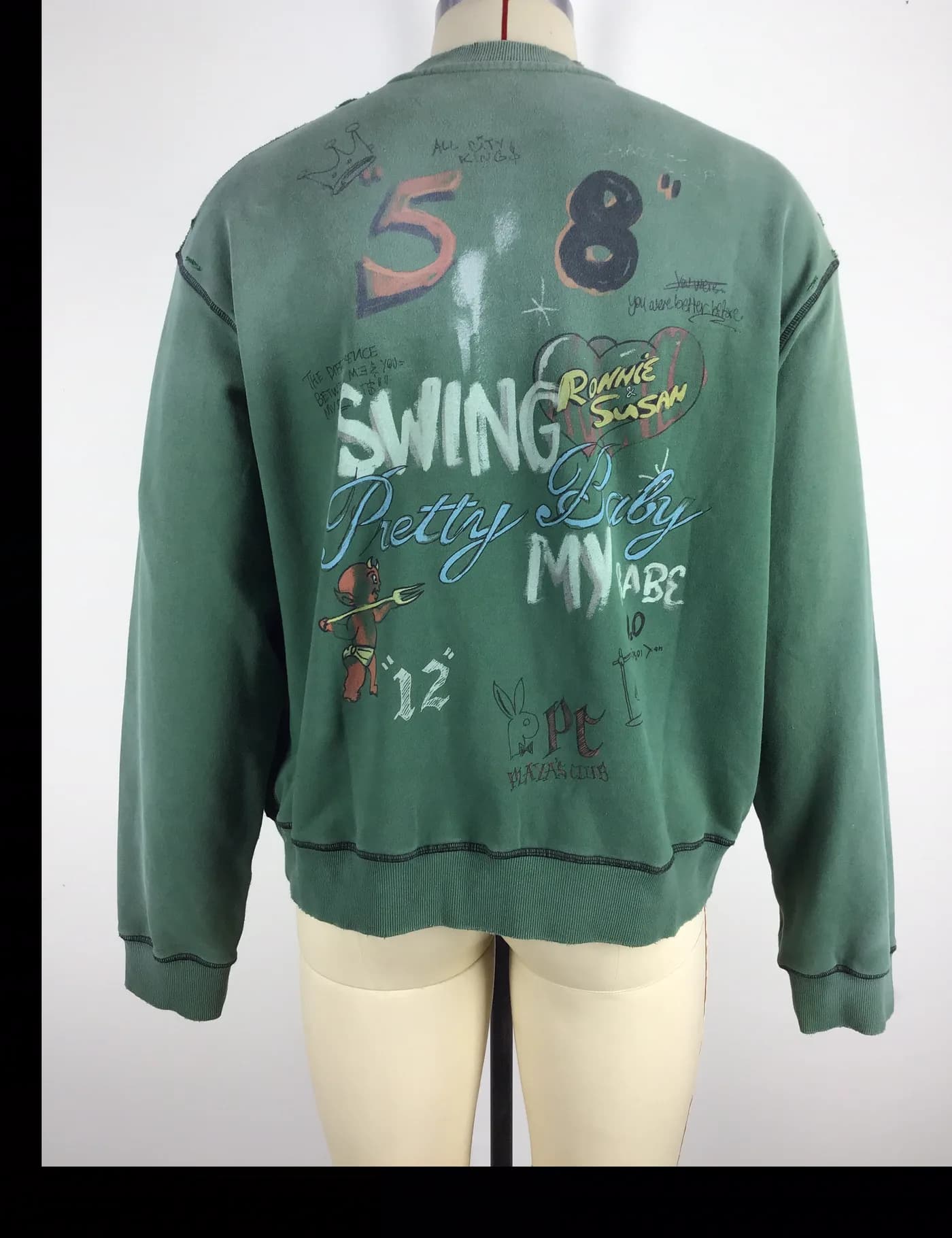 Actual green vintage washed graphic crewneck sweatshirt sample shown from the back on a mannequin