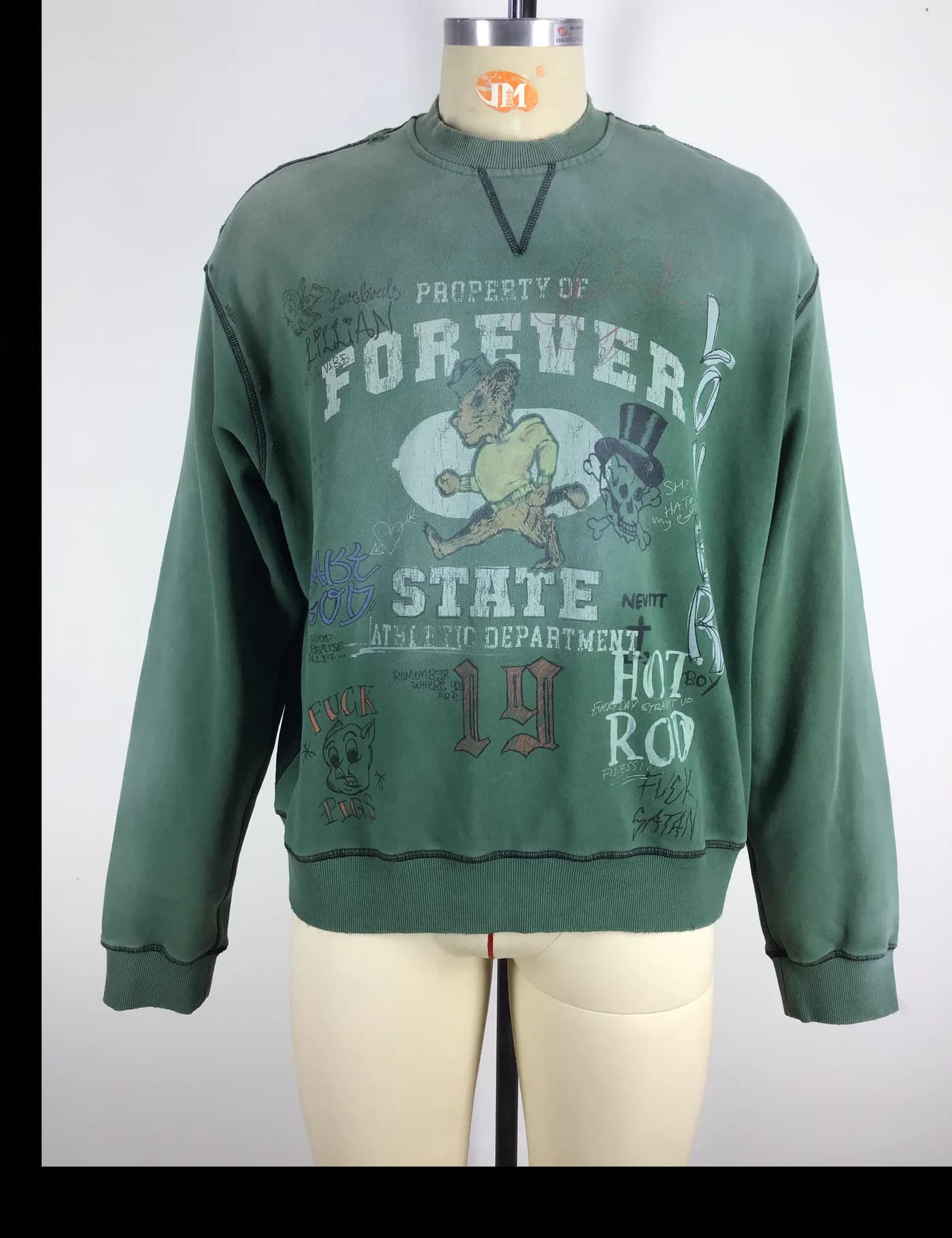 Actual green vintage washed graphic crewneck sweatshirt sample shown from the front on a mannequin