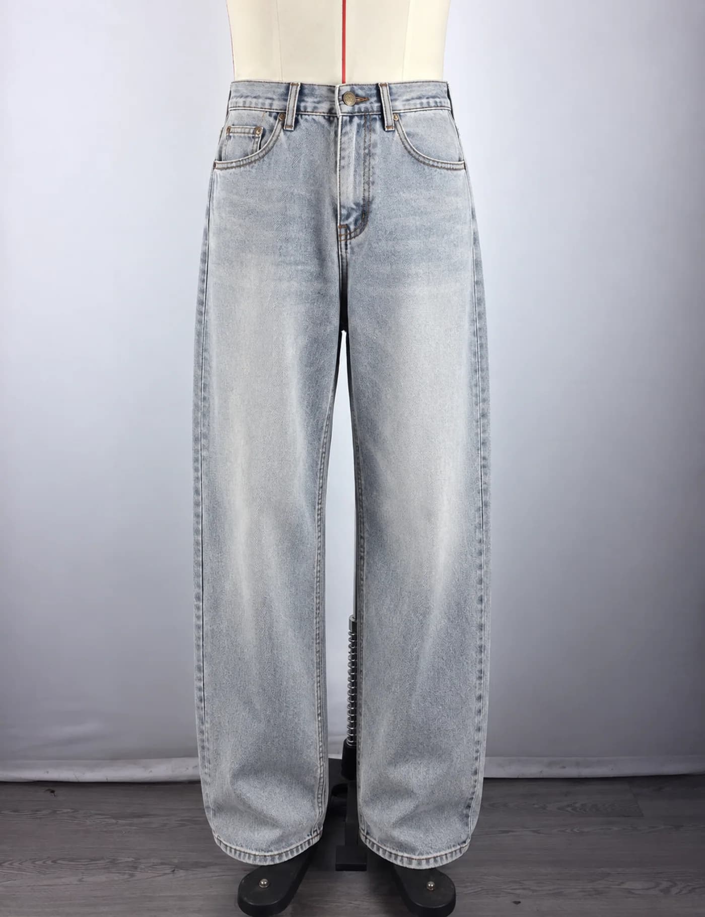 Actual light-wash extra-wide-leg jeans sample shown from the front on a mannequin