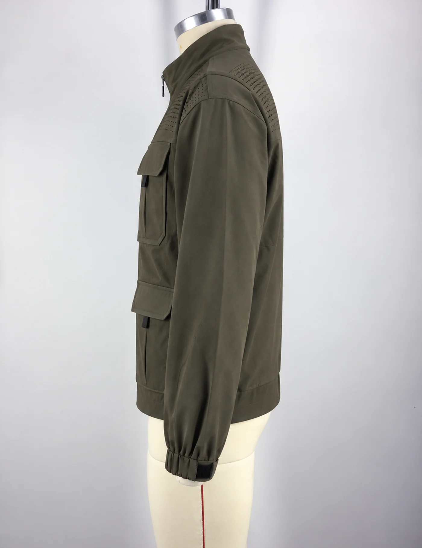 Actual multi-pocket stand-collar utility jacket sample shown from the side on a mannequin