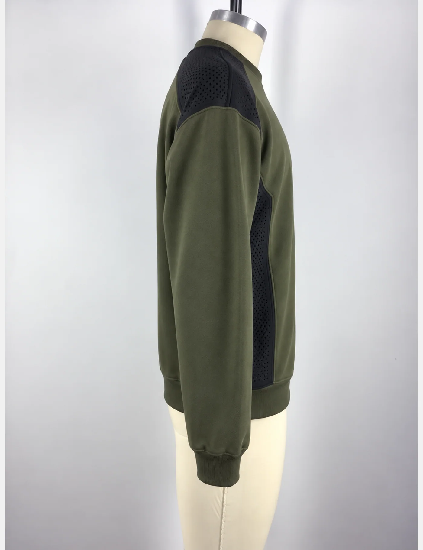 Actual perforated-panel utility crewneck sweatshirt sample shown from the side on a mannequin