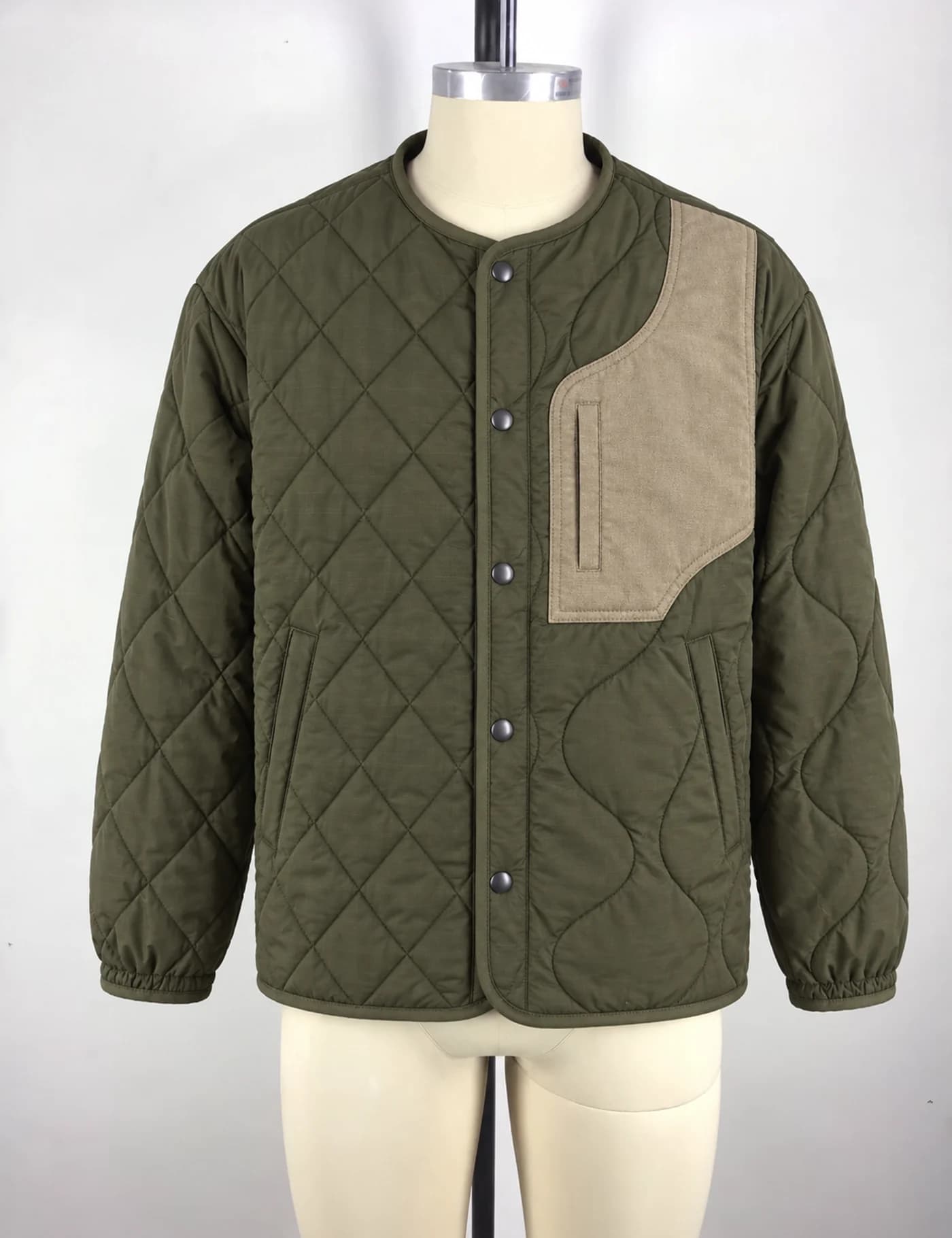 Actual quilted patchwork jacket sample shown from the front on a mannequin