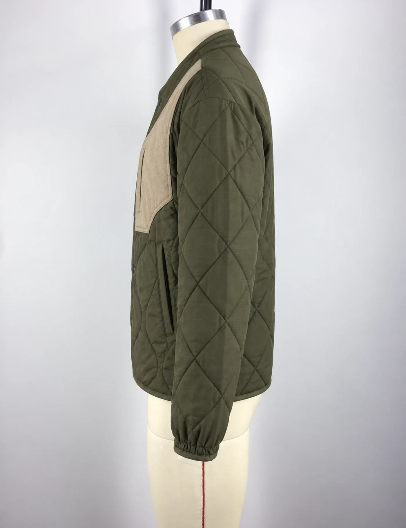 Actual quilted patchwork jacket sample shown from the side on a mannequin
